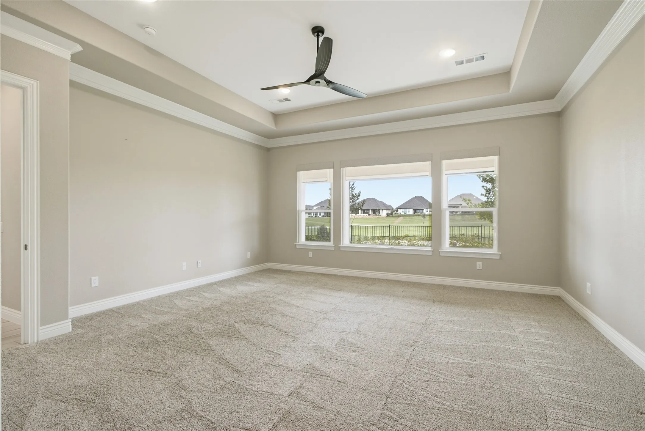 Cove ceilings, remote control window shades and ceiling fan. Overlooks the golf course.