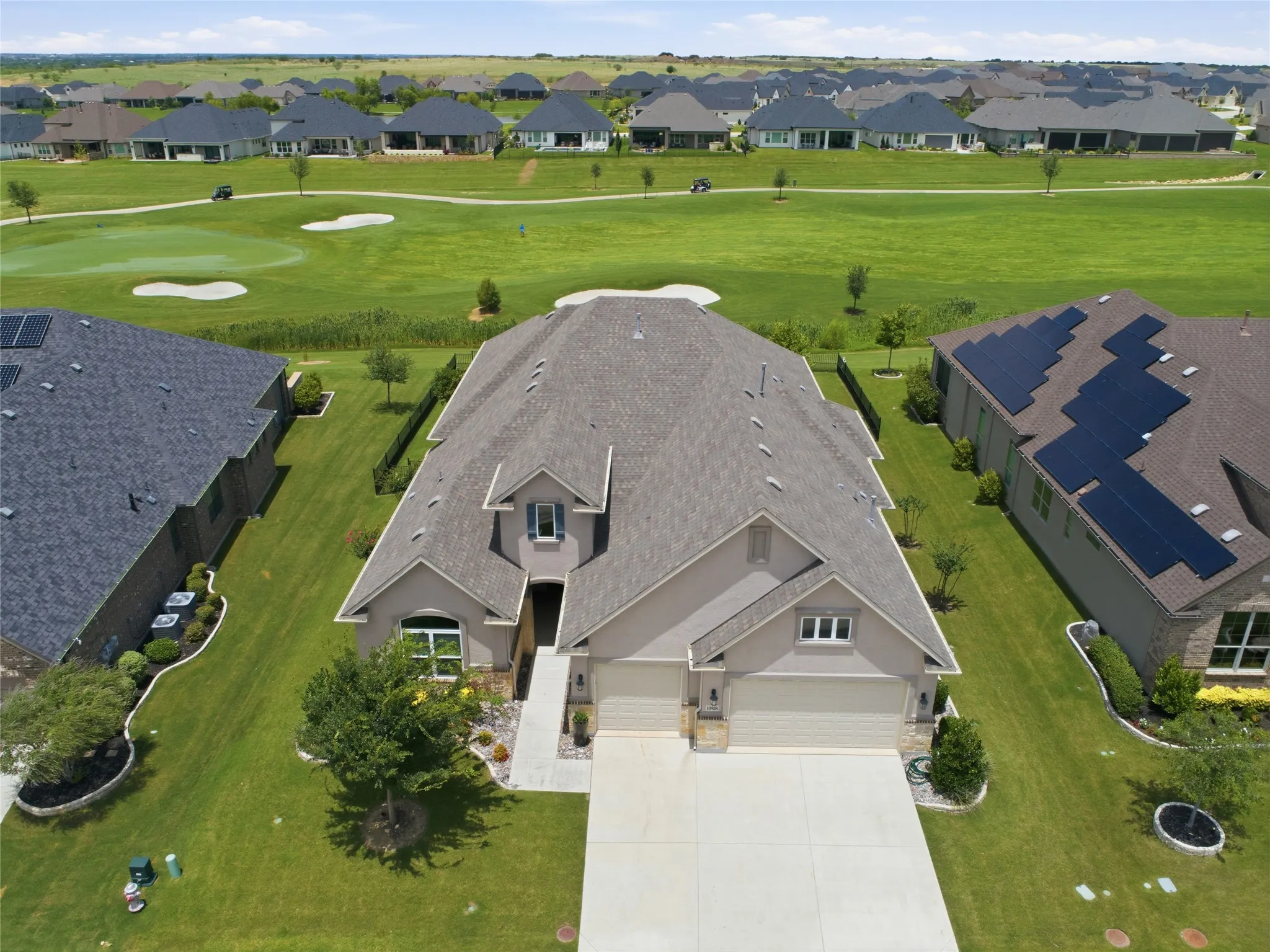 Drone view showing 10908 Goodland on the golf course