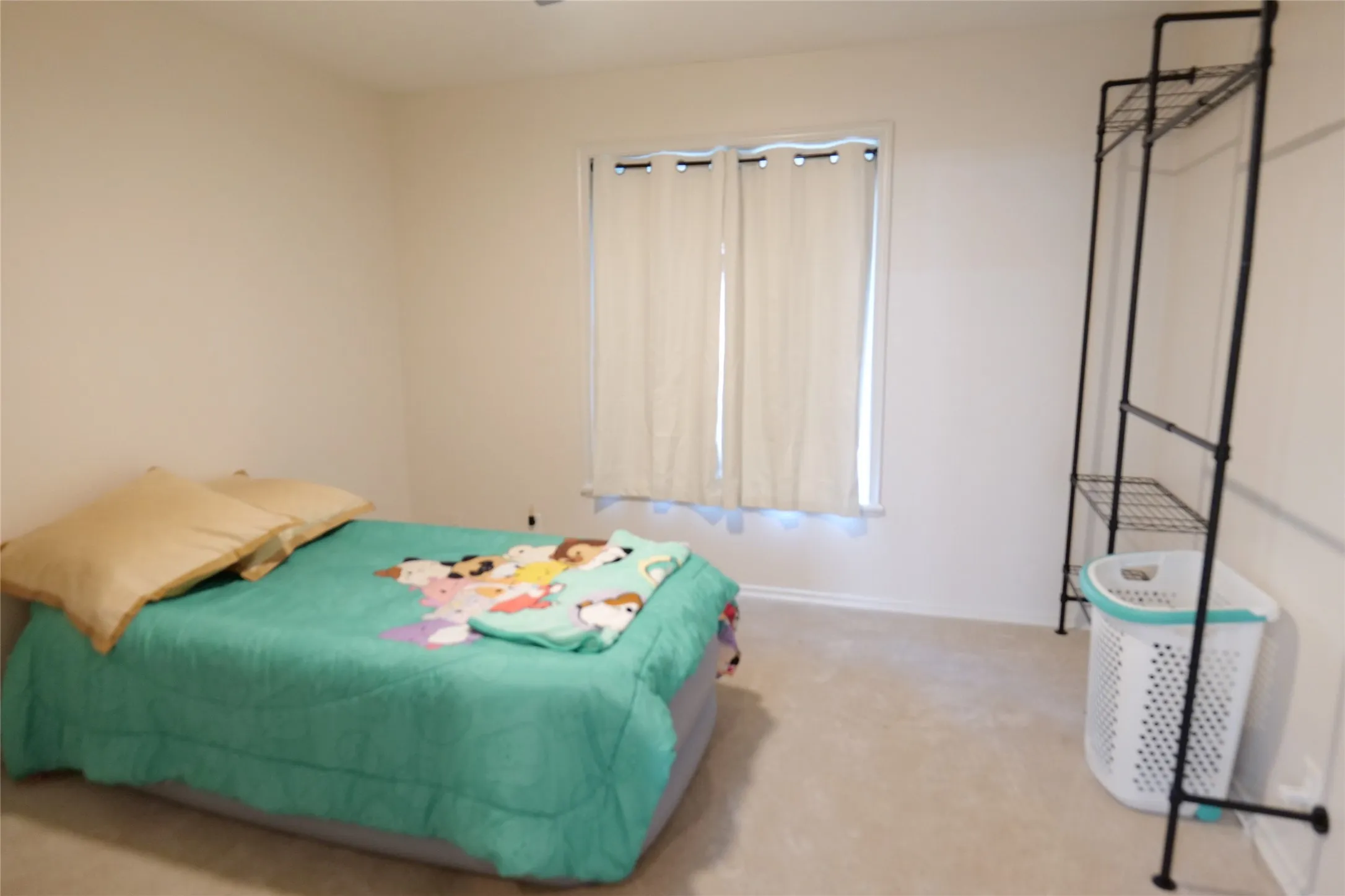 Neutral tone wall paint and window with curtain rods