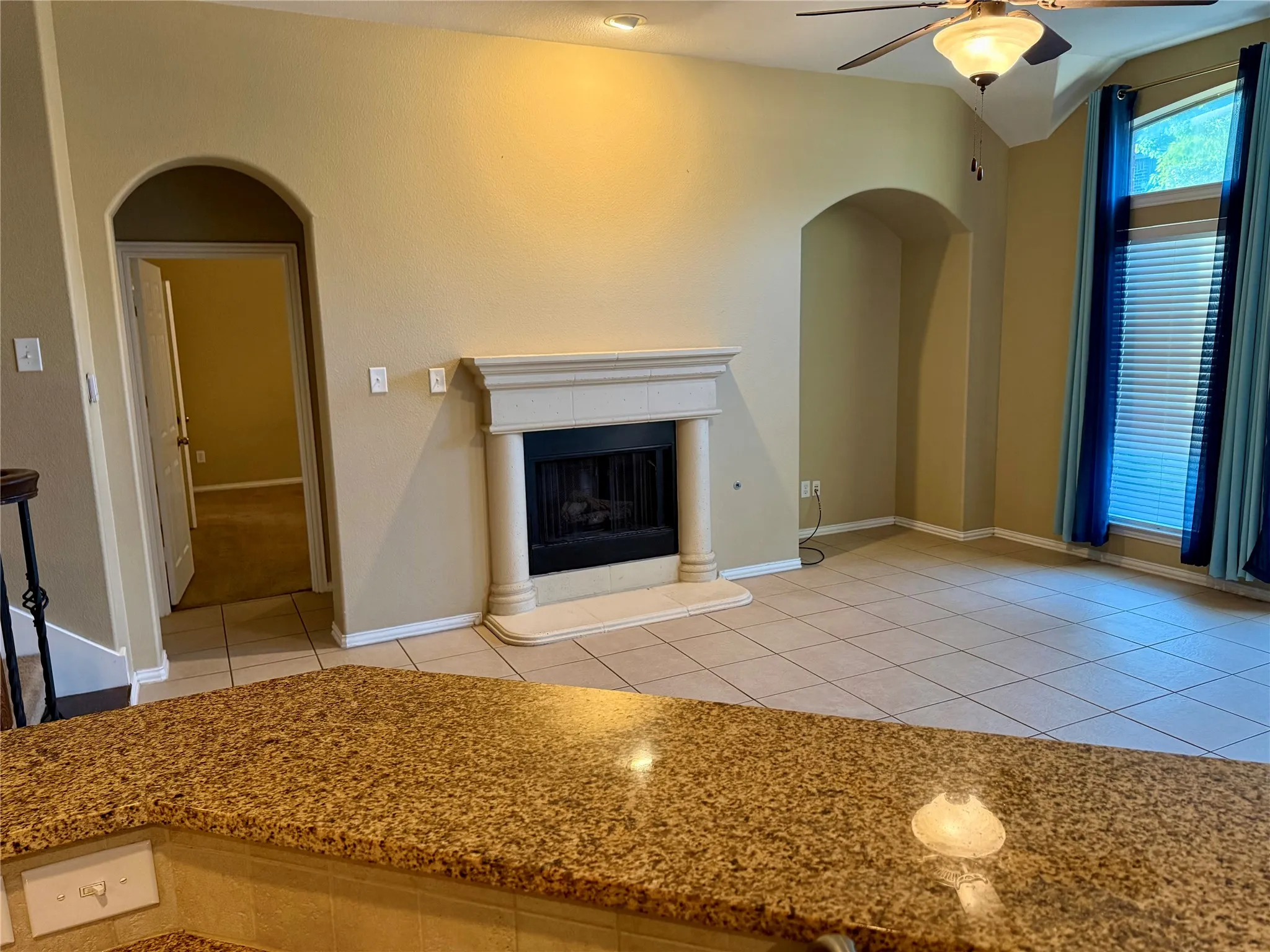 Granite-look countertop with an integrated tile backsplash