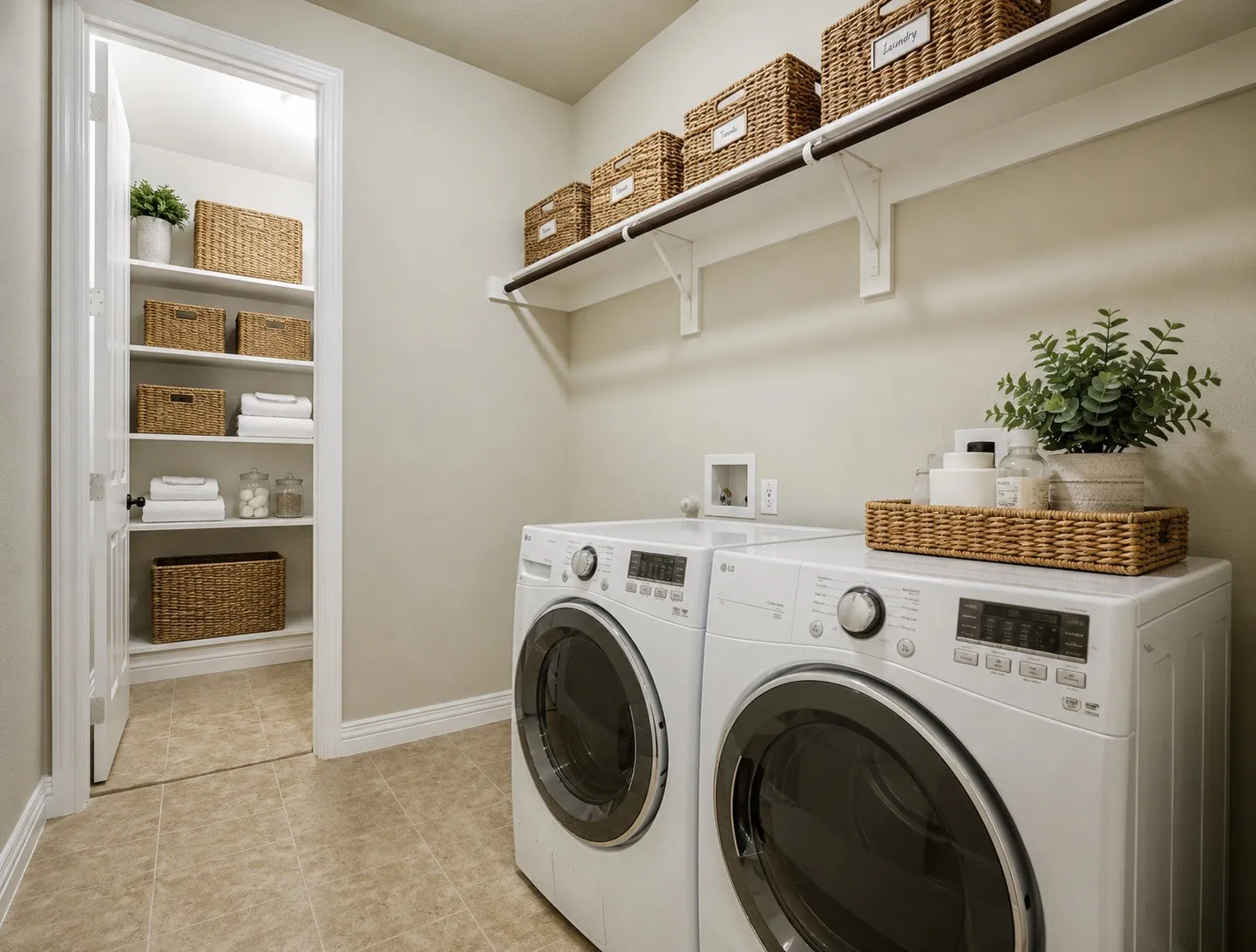 Spacious laundry with extra storage closet