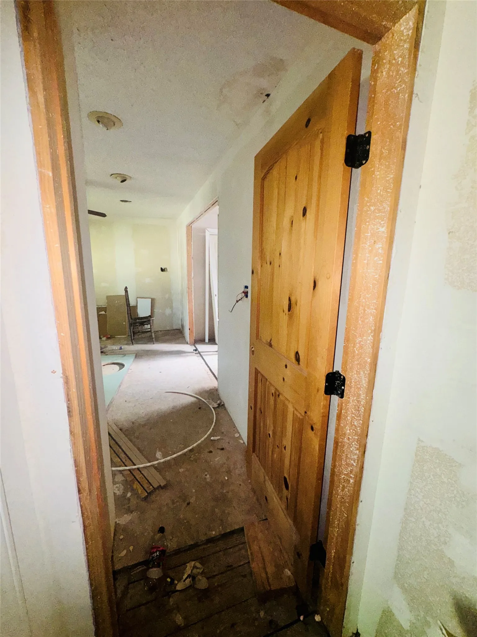Wood-paneled door with black hardware