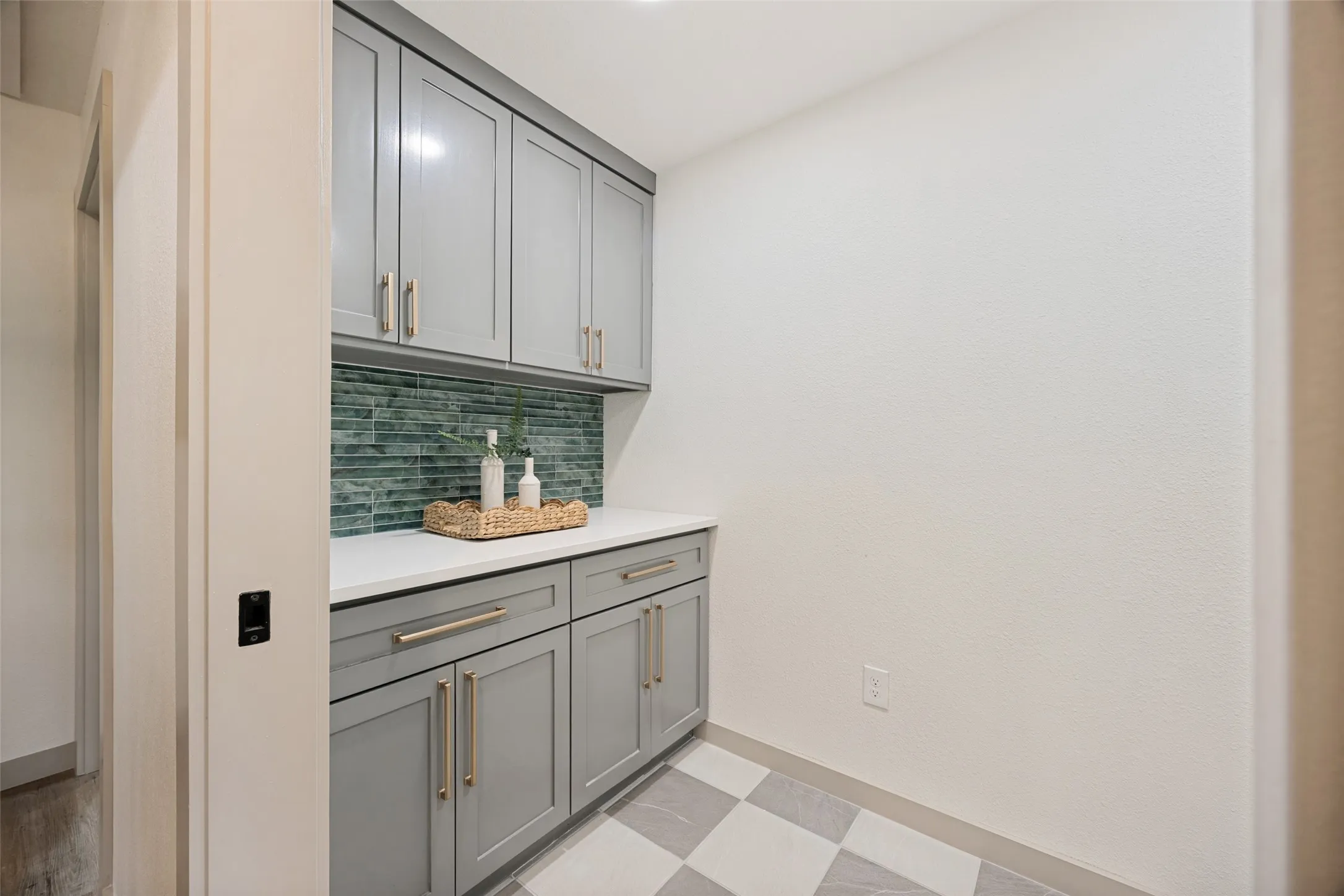 Over sized Laundry room with storage, folding table and side by side washer and dryer