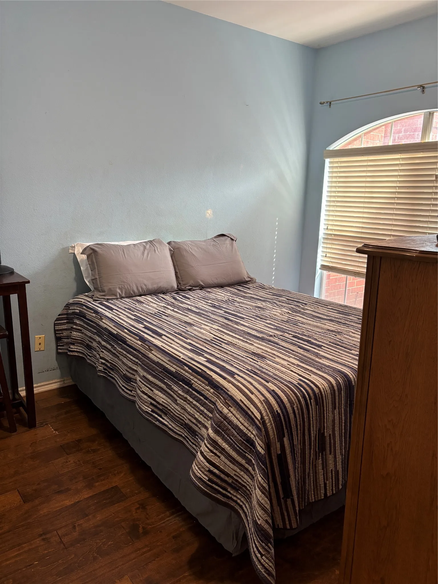 Wood-finish flooring with a light blue wall finish