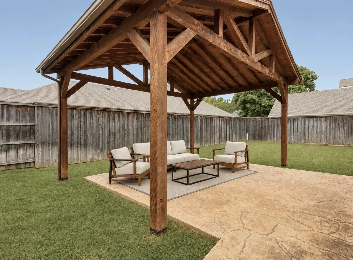 Expansive backyard featuring a custom wooden pergola with exposed rafters, a stamped concrete patio, and a privacy fence