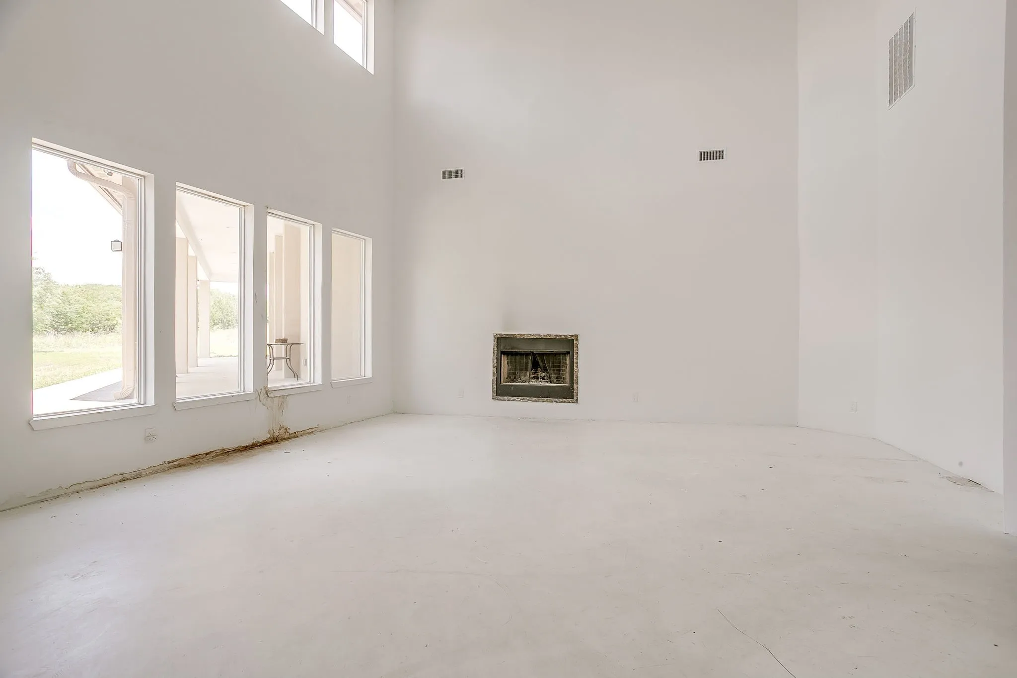 No flooring, wood burning fireplace.