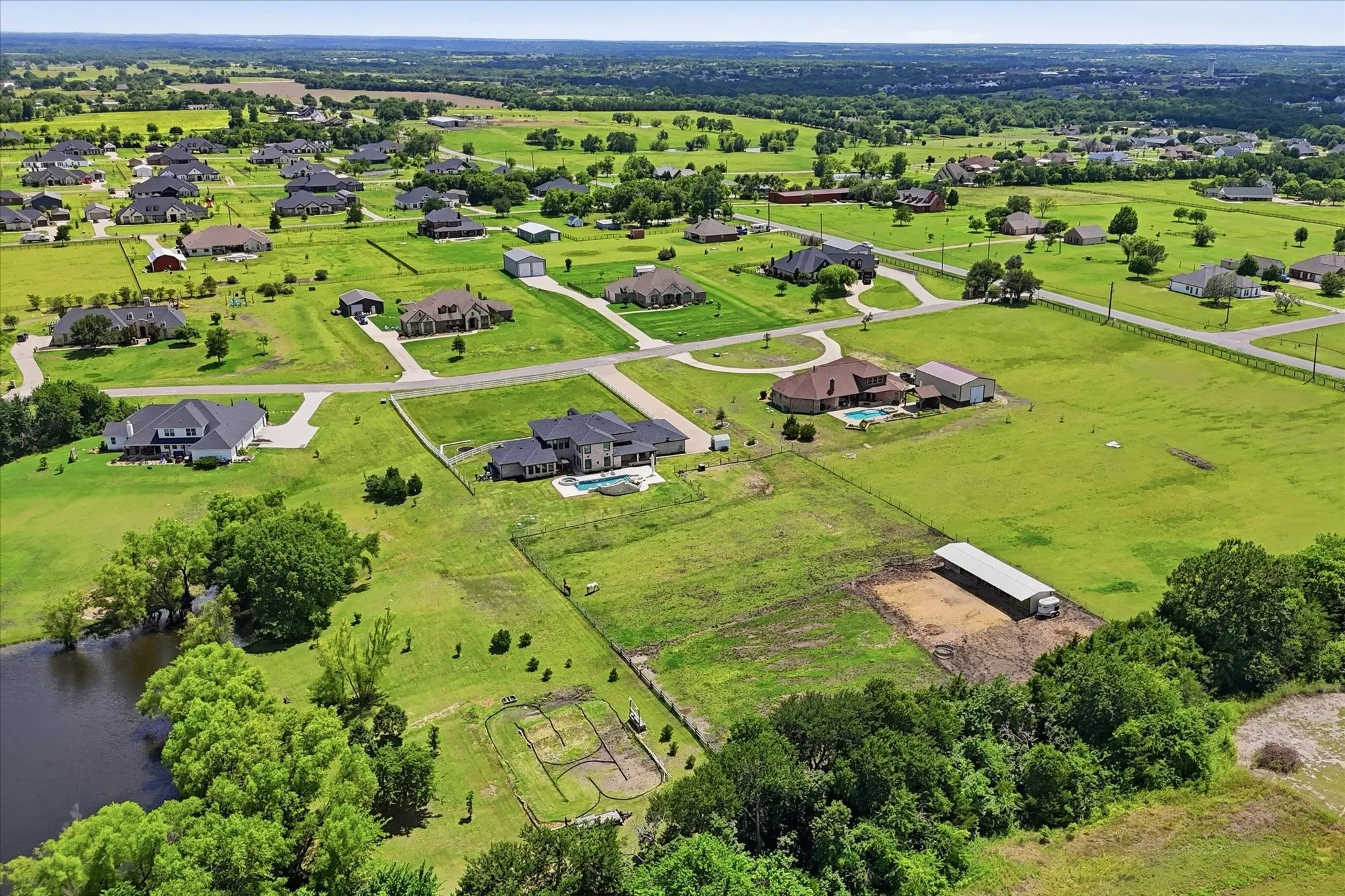 Expansive aerial showcasing a residential community with large individual properties