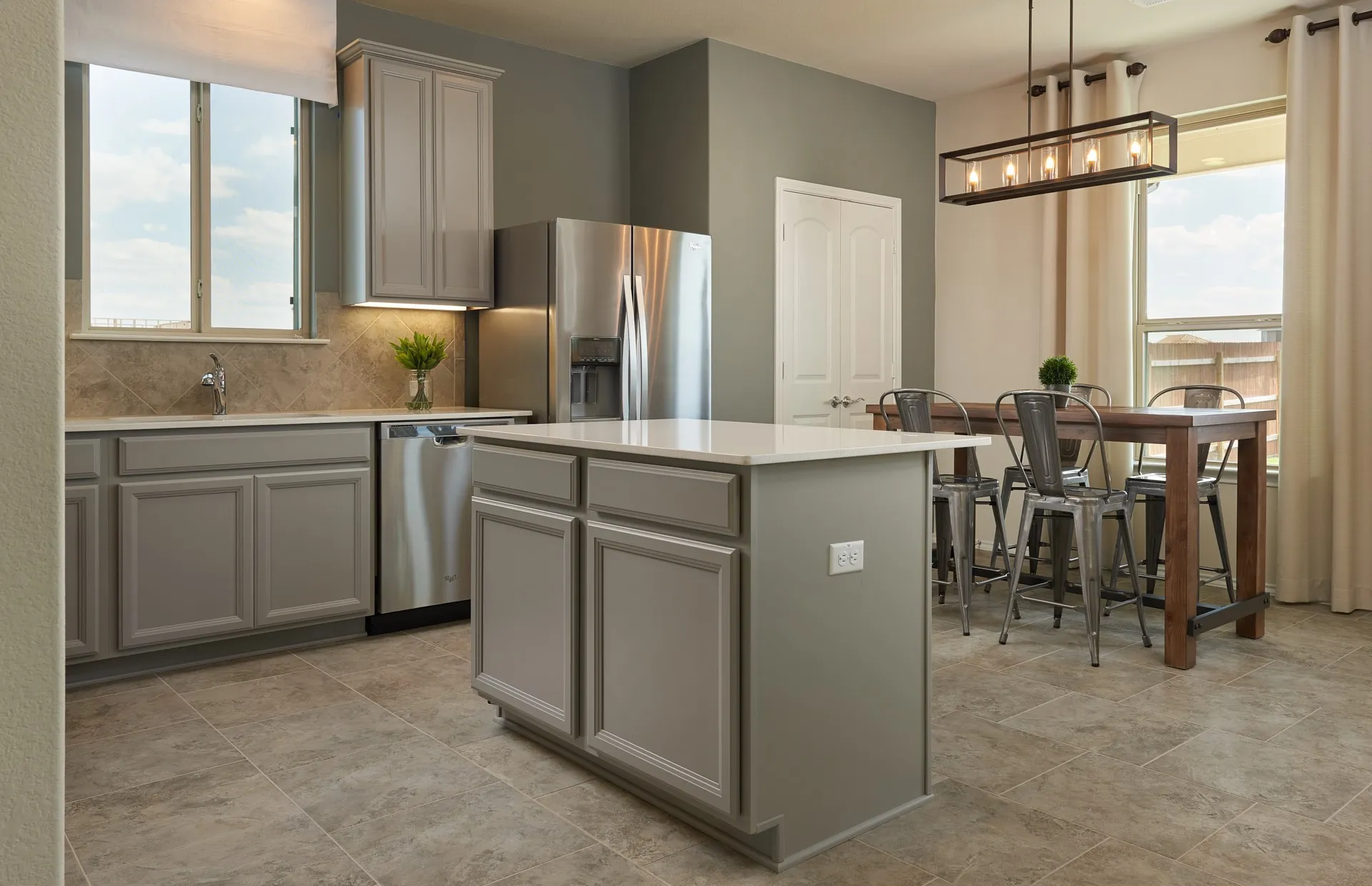 *Model Representation - Large island overlooking gathering room and dining areas