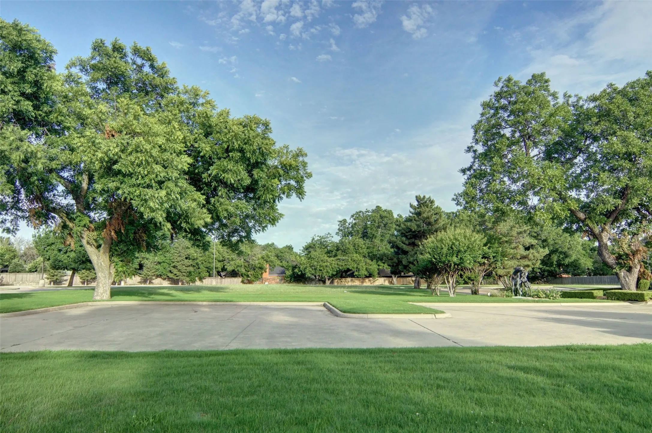 The lot includes several concrete parking spaces.