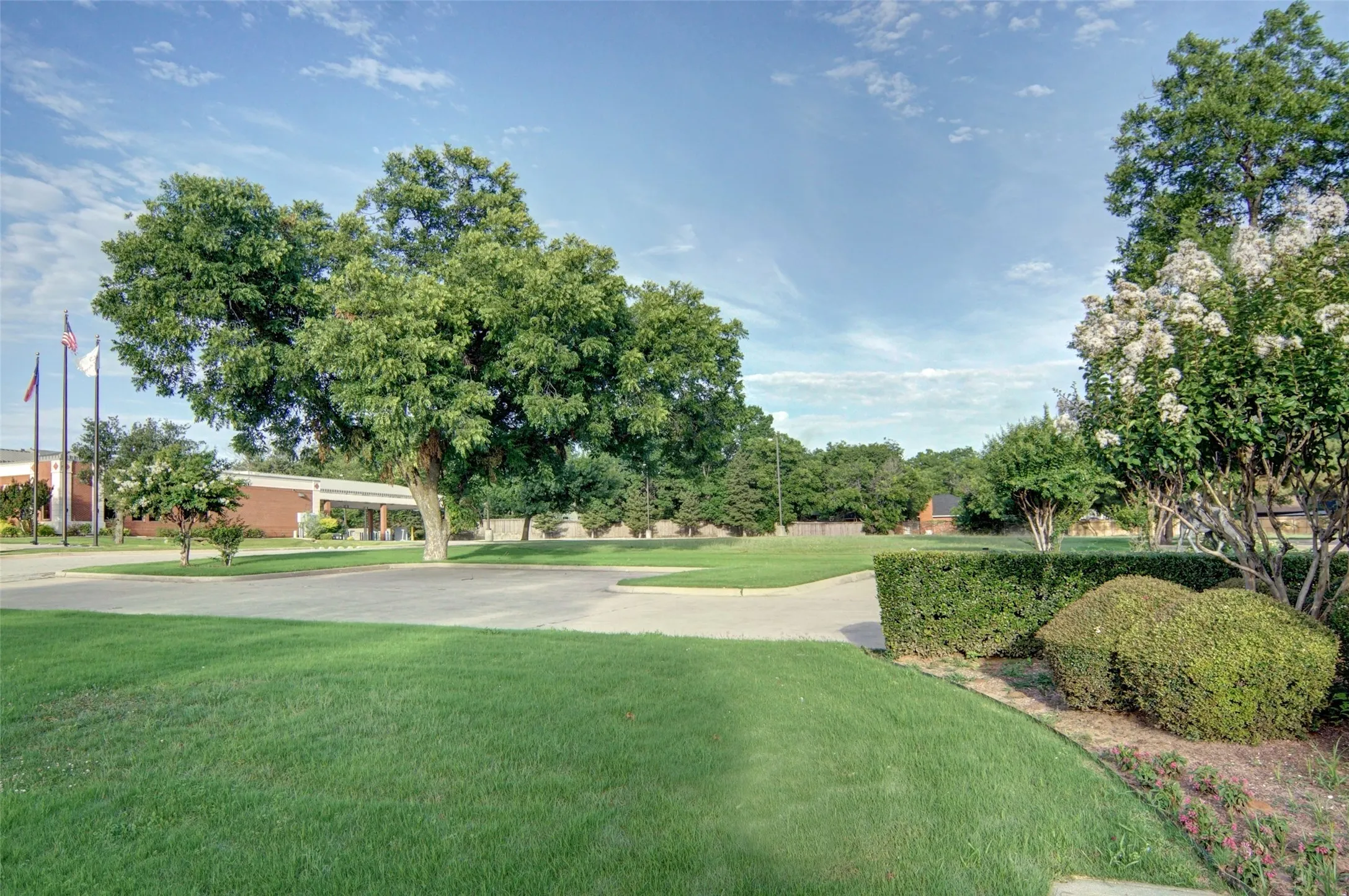 Professional landscaping graces the neighbors' lots on the north and south side.