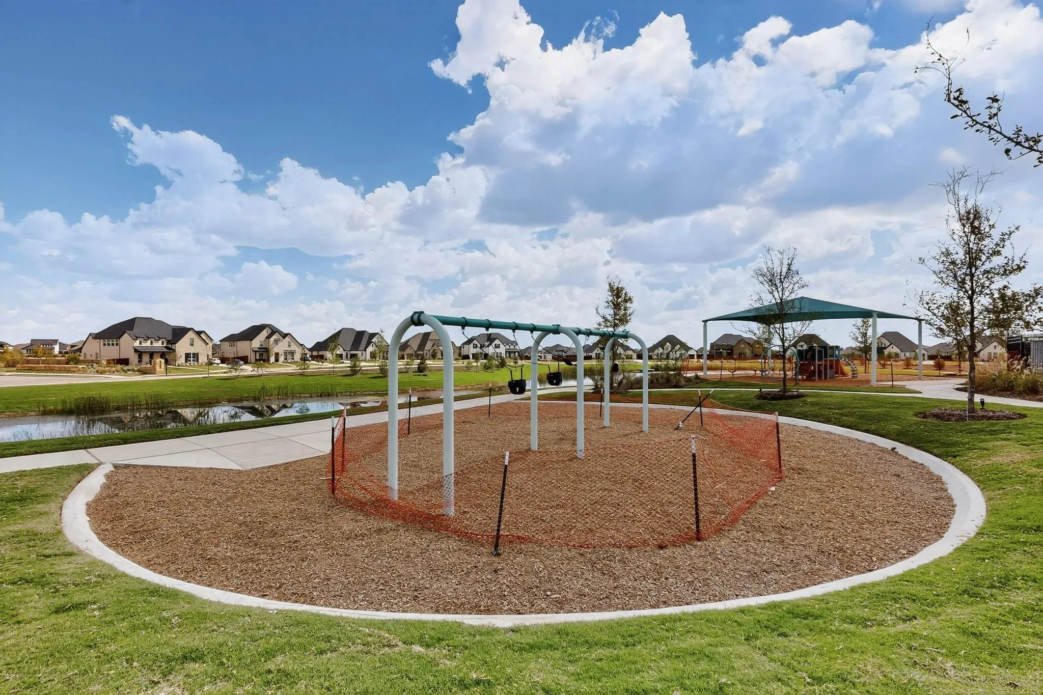 View of property's community with a residential view, a yard, and a water view