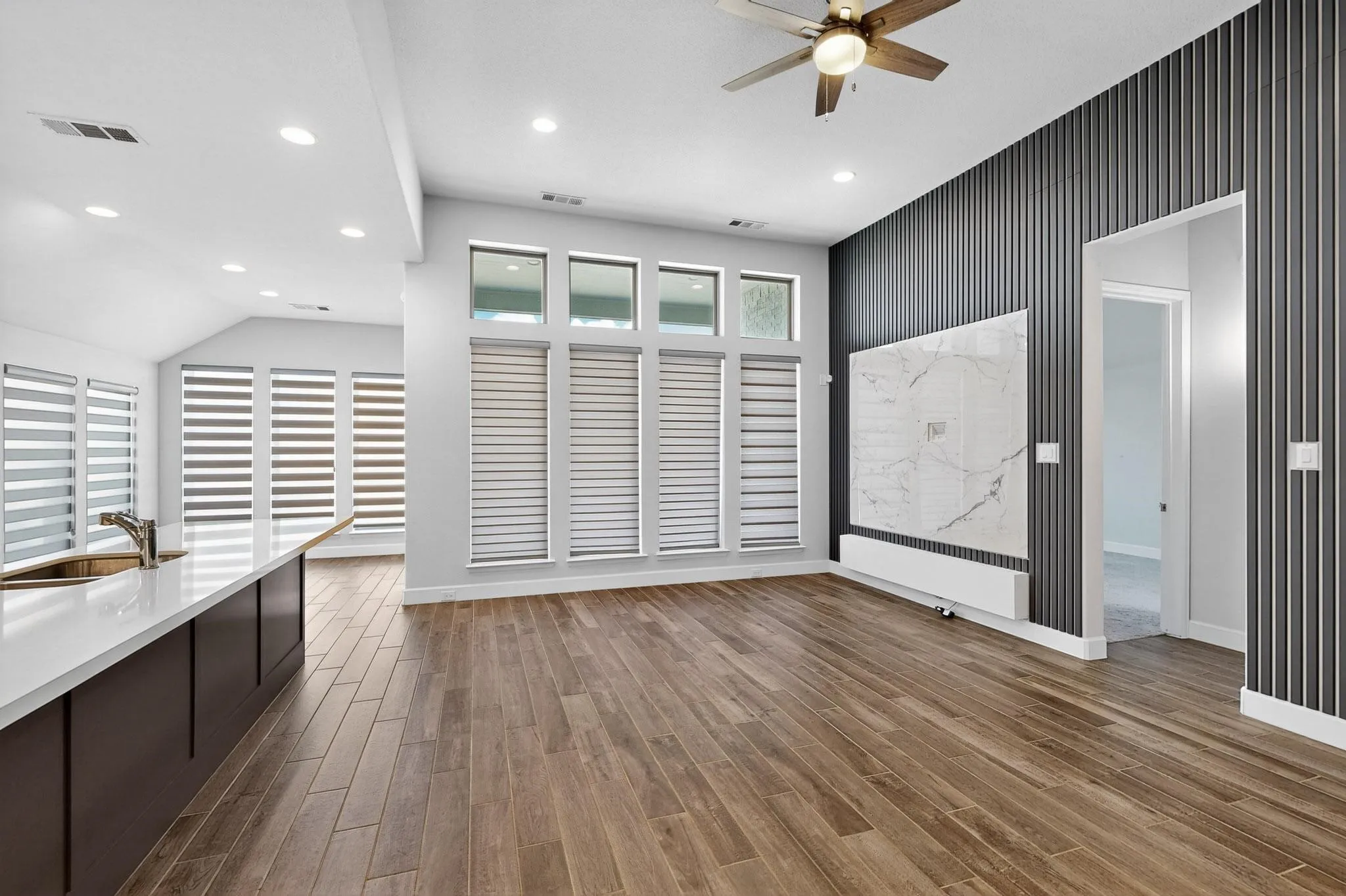 Unfurnished living room featuring recessed lighting, dark wood-style floors, and ceiling fan