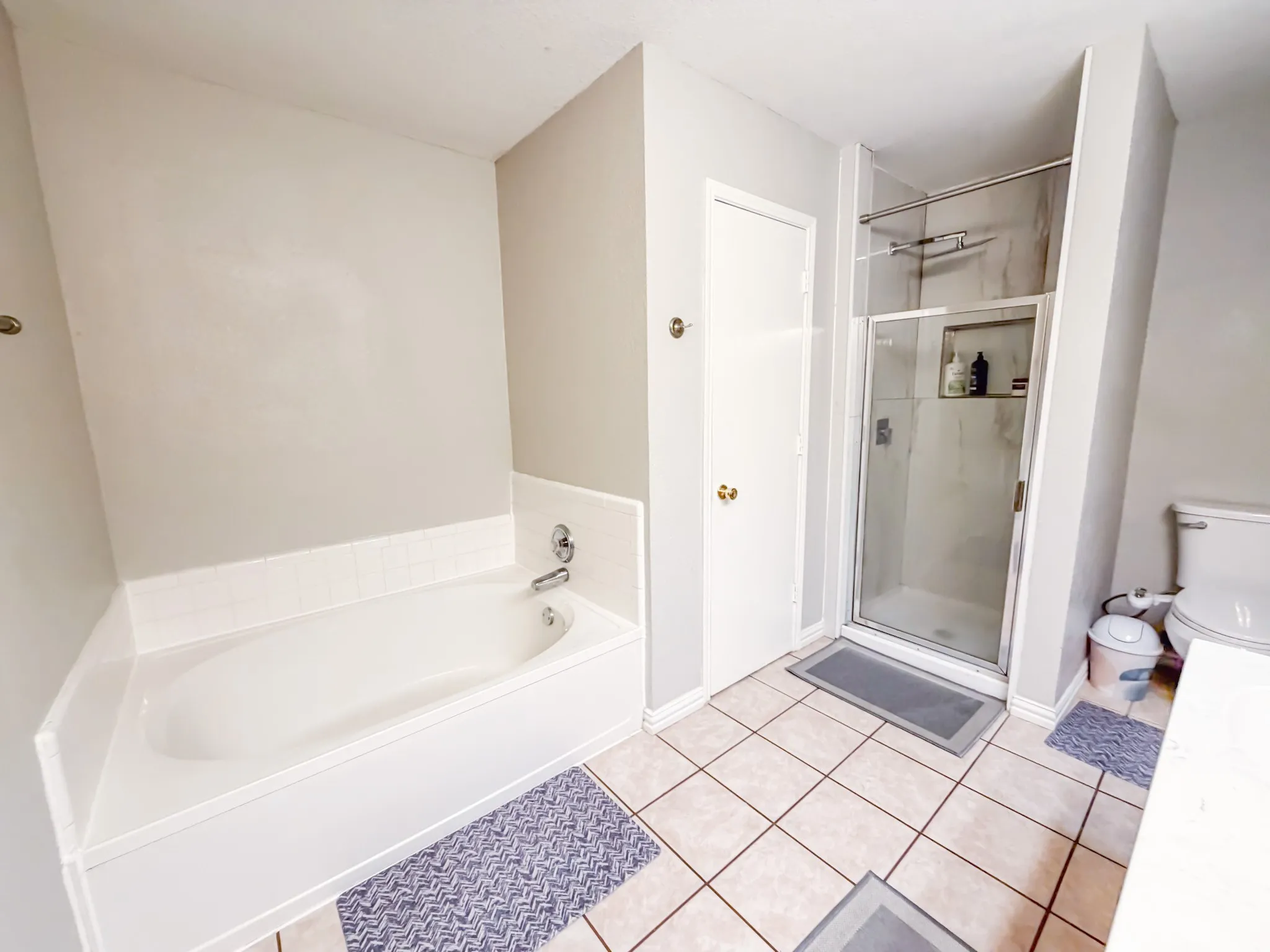 Contemporary bathroom with a corner soaking tub and chrome fixtures