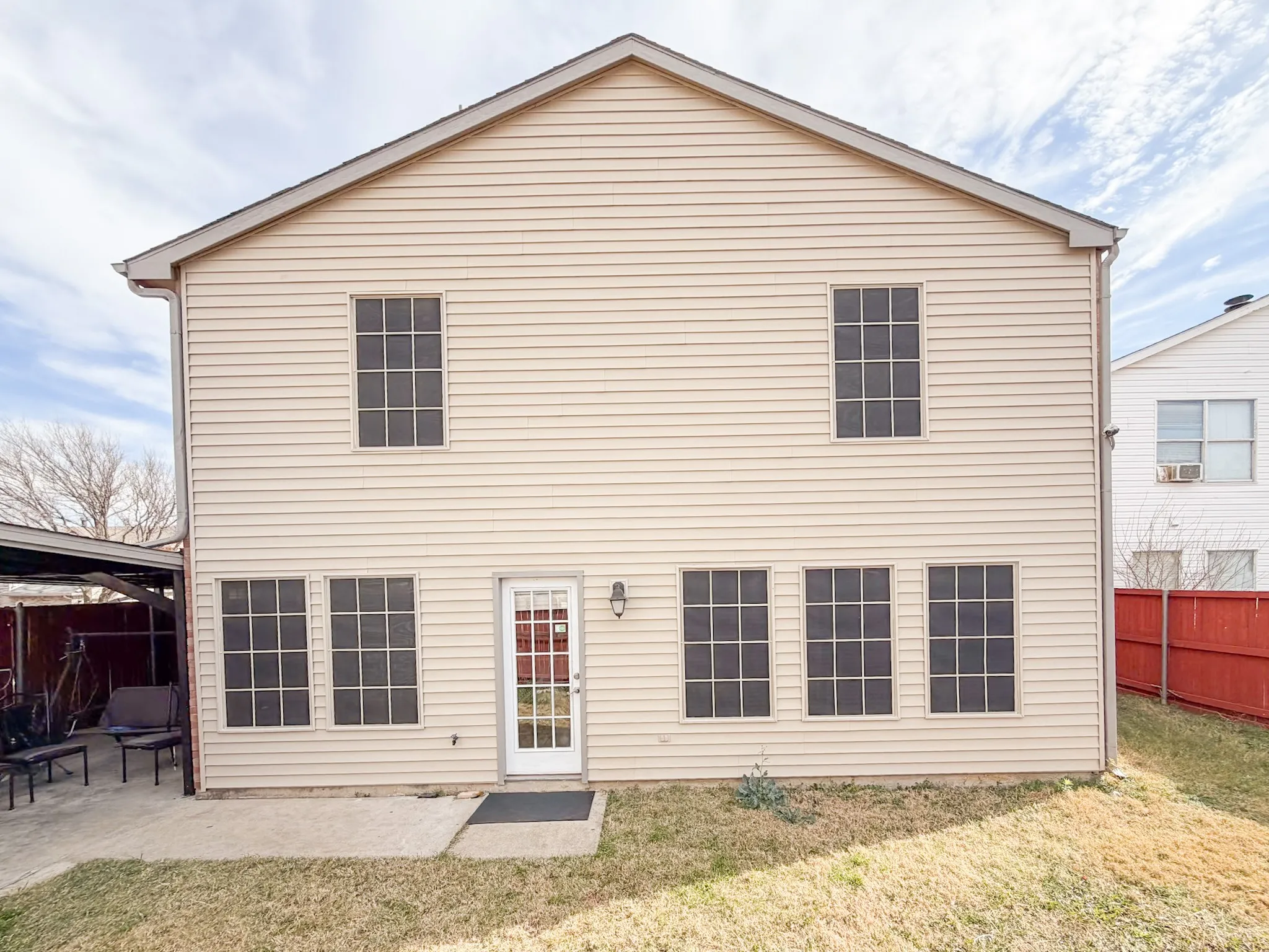 Two-story exterior with horizontal siding and a gable roofline