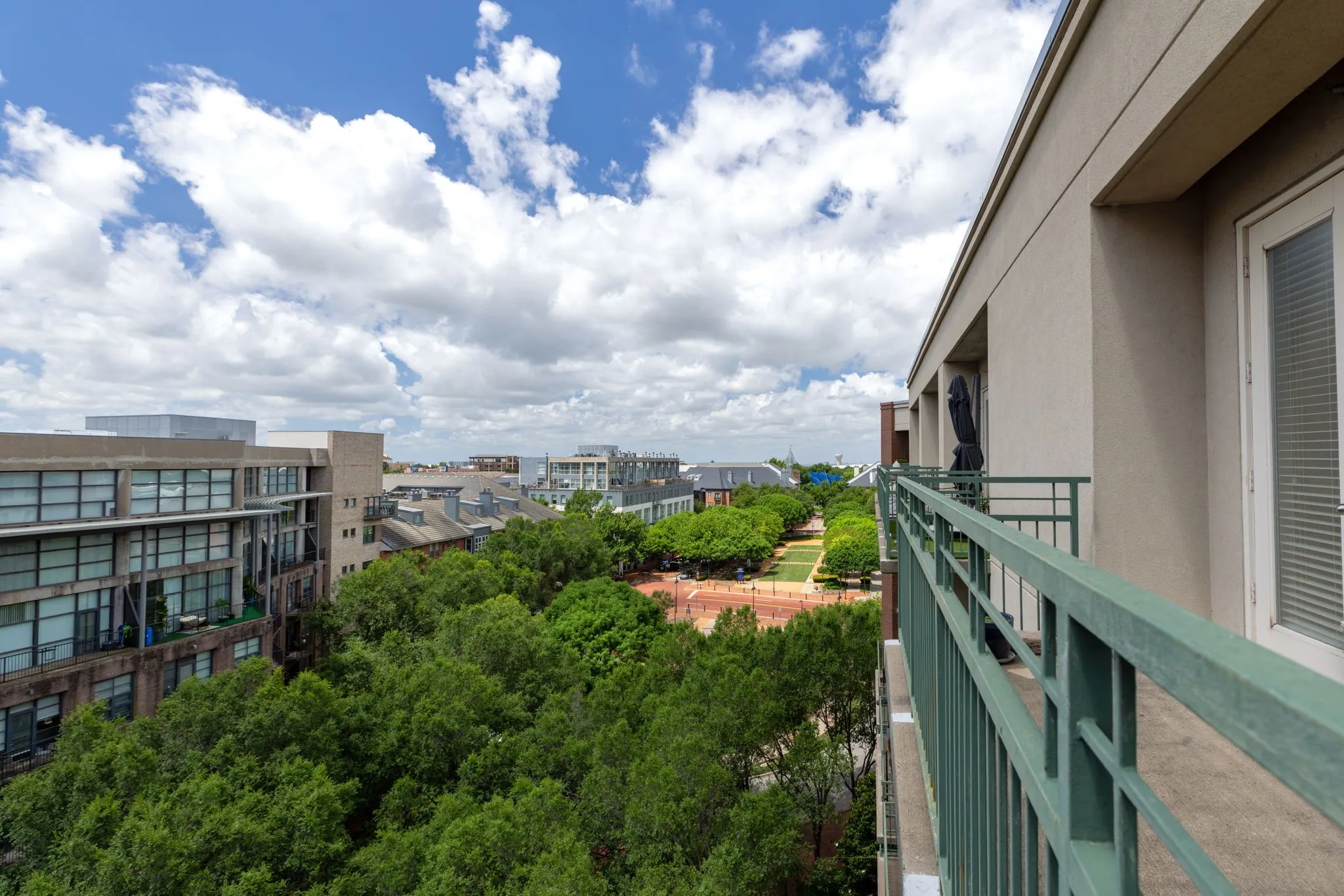 Looking west from the front balcony with the leafy view of the vibrant Addison Circle. Imagine watching Kaboom Town fireworks from this vantage point!