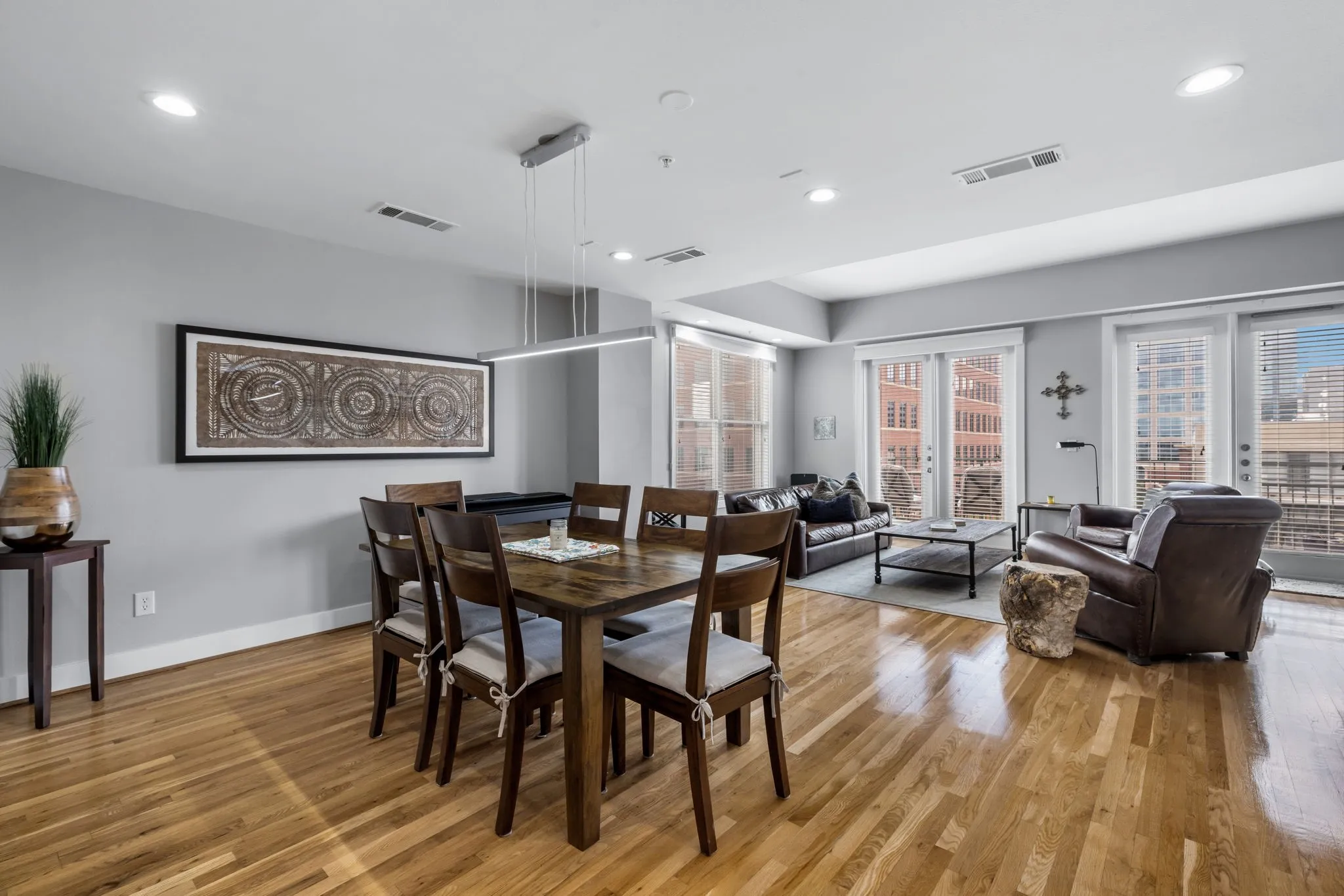 Dining/living combo area is quite large and has great natural light from the large windows and doors to the patio.