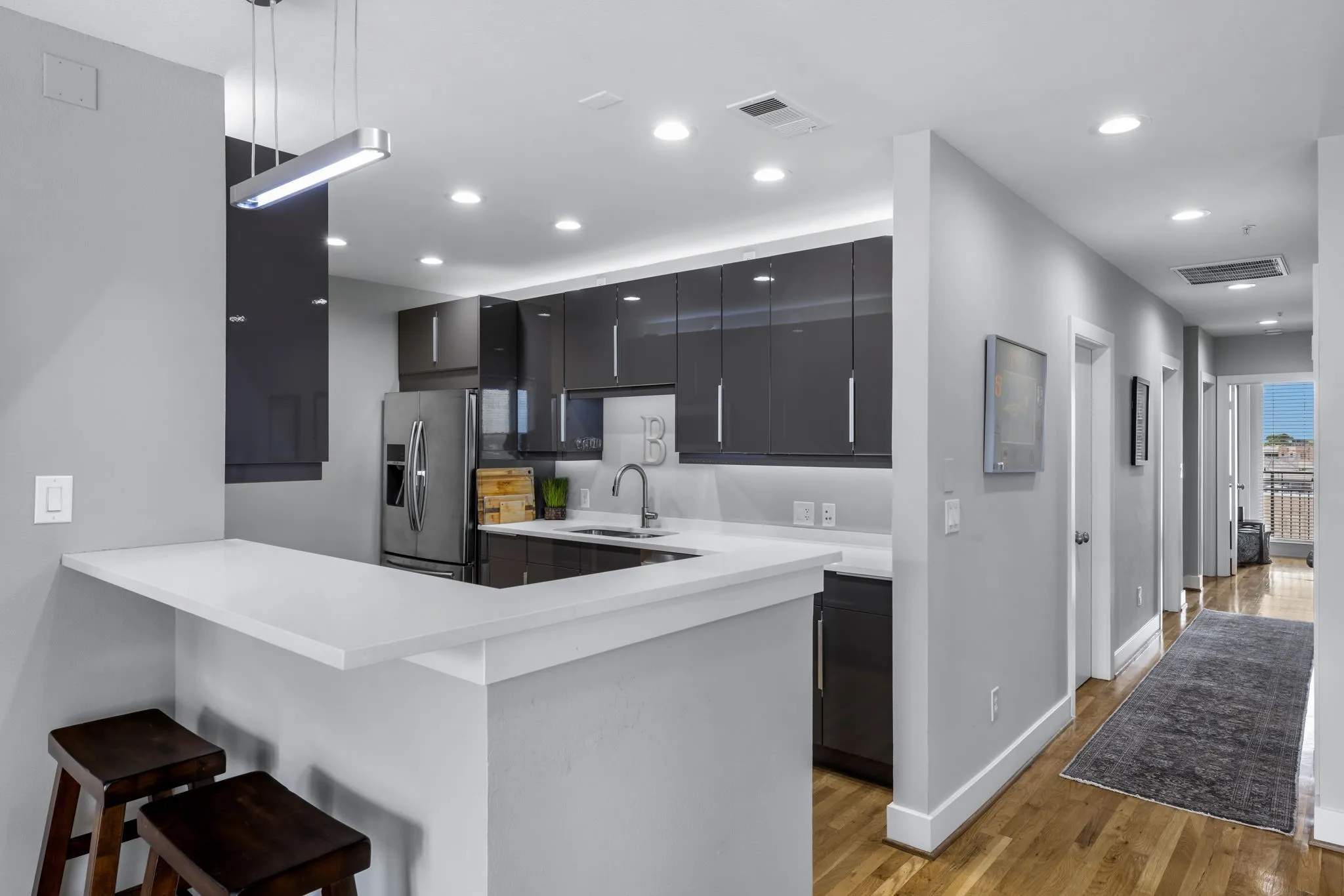 A convenient breakfast bar is included with the well-appointed and updated kitchen.