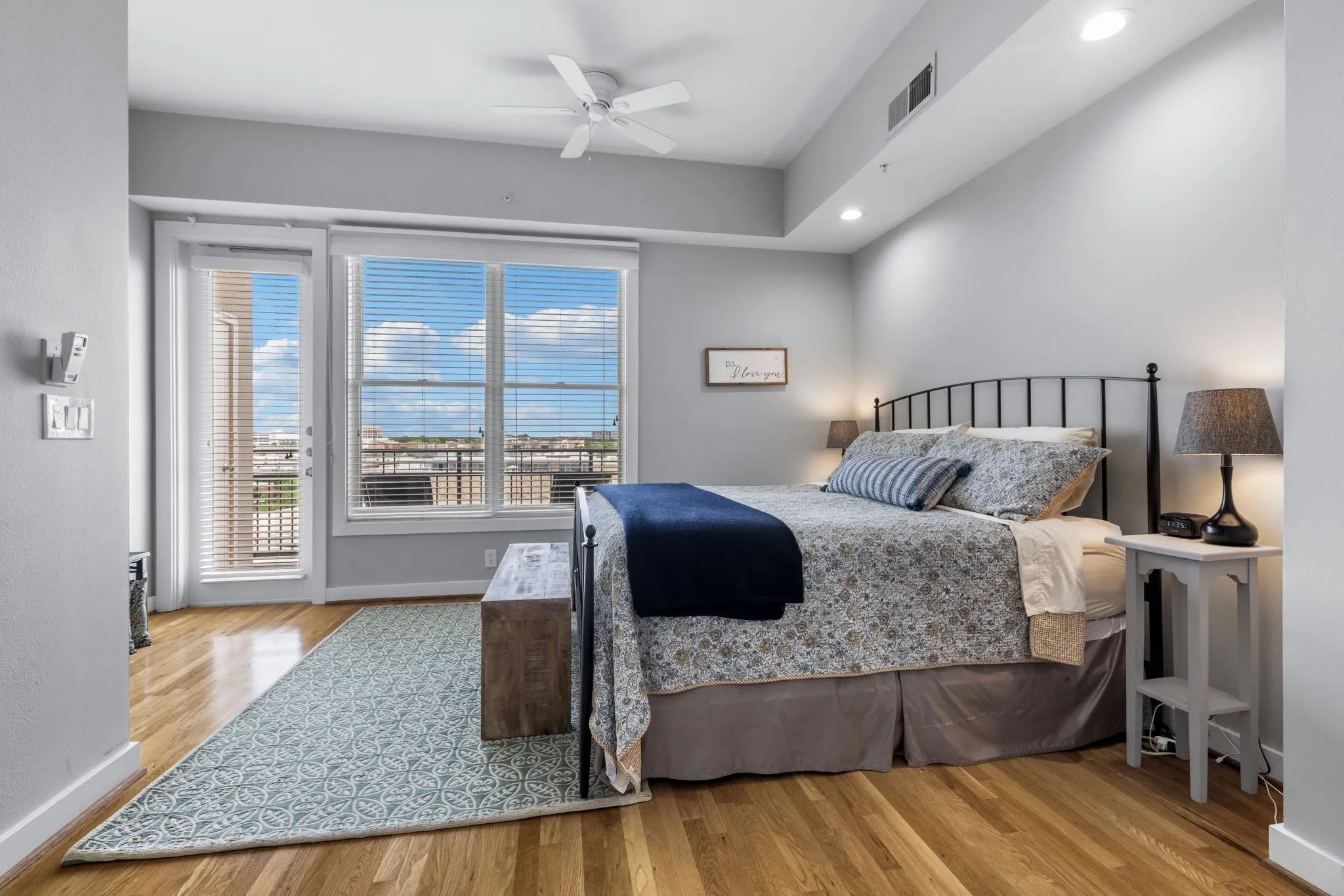 Primary bedroom has access to a large balcony overlooking the grounds.
