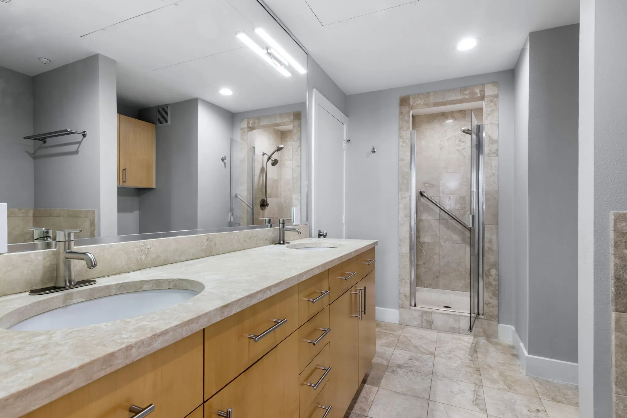 Well appointed and luxurious primary bath with a large walk-in closet.