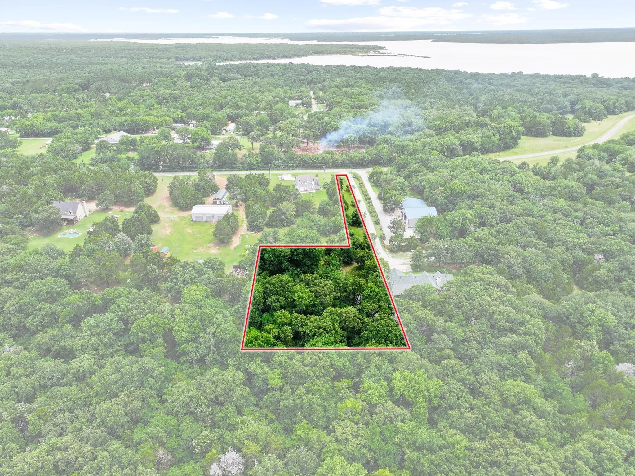 Expansive wooded lot offering substantial privacy