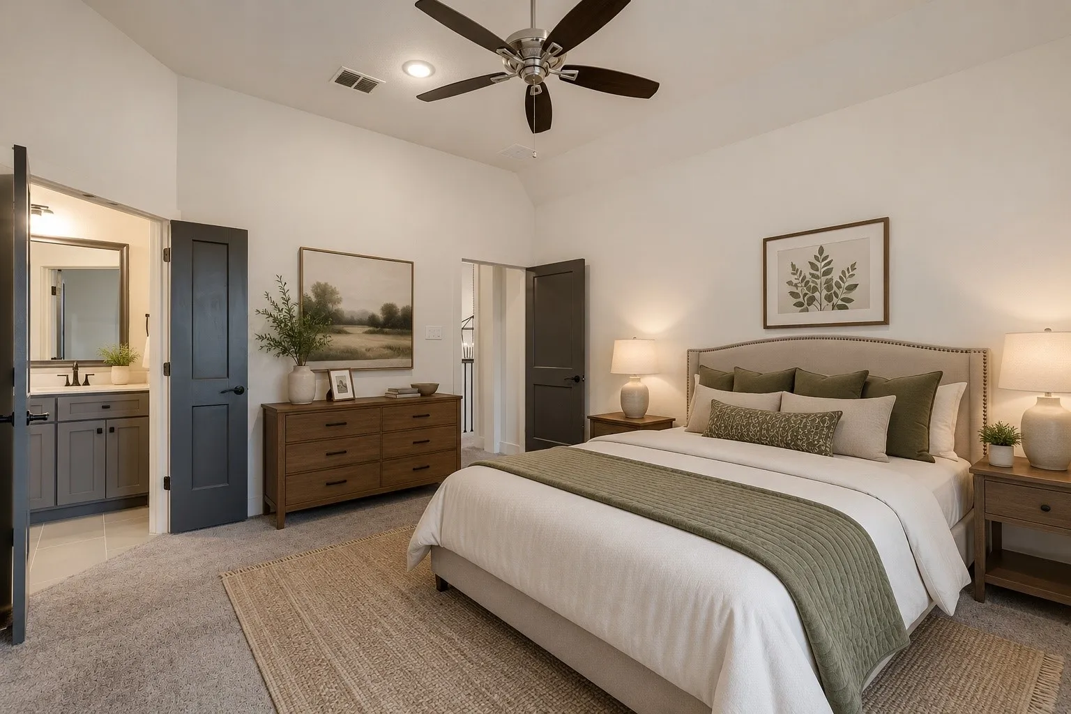 Spacious room featuring vaulted ceilings, a ceiling fan with integrated lighting, and carpet flooring