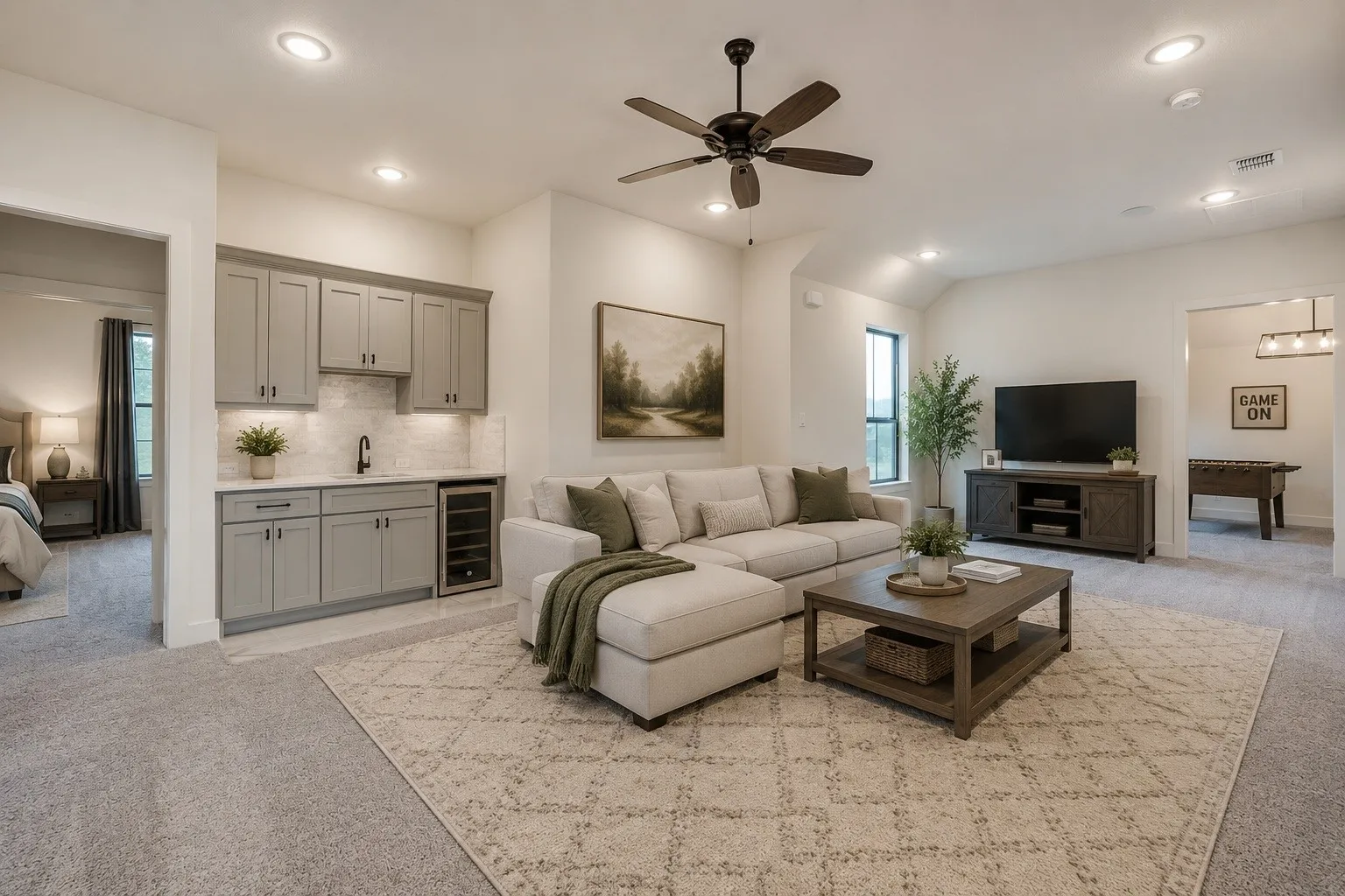 Open-concept living space featuring a wet bar with gray cabinetry, white countertops, and a beverage cooler. * Photo virtually staged using AI.