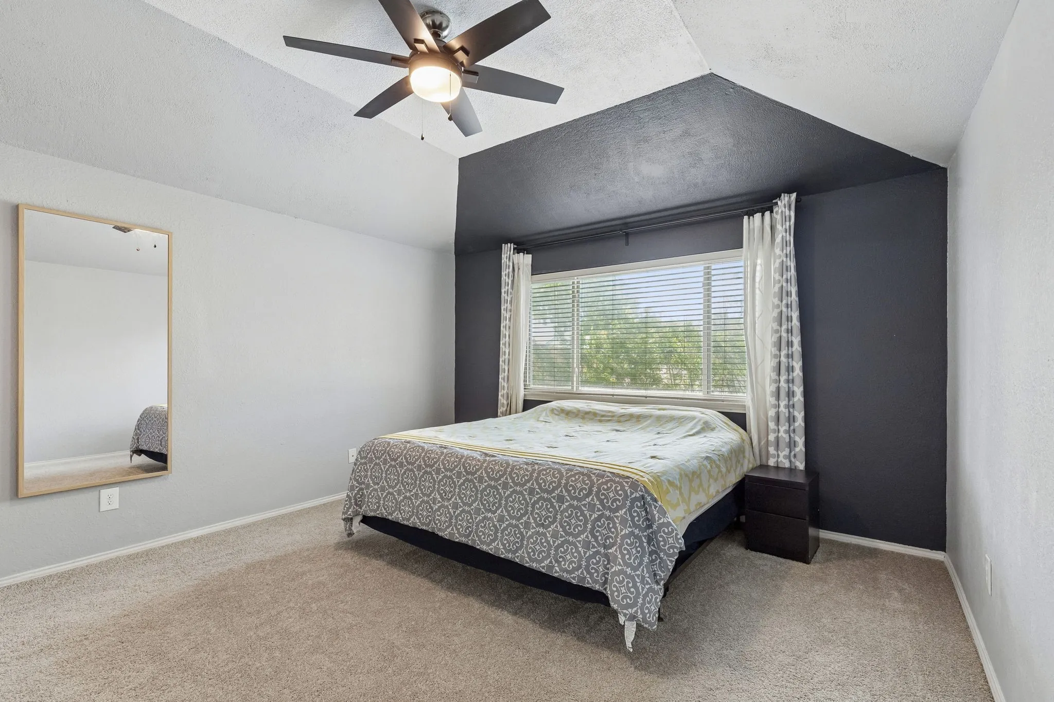 Bedroom featuring carpet flooring and ceiling fan