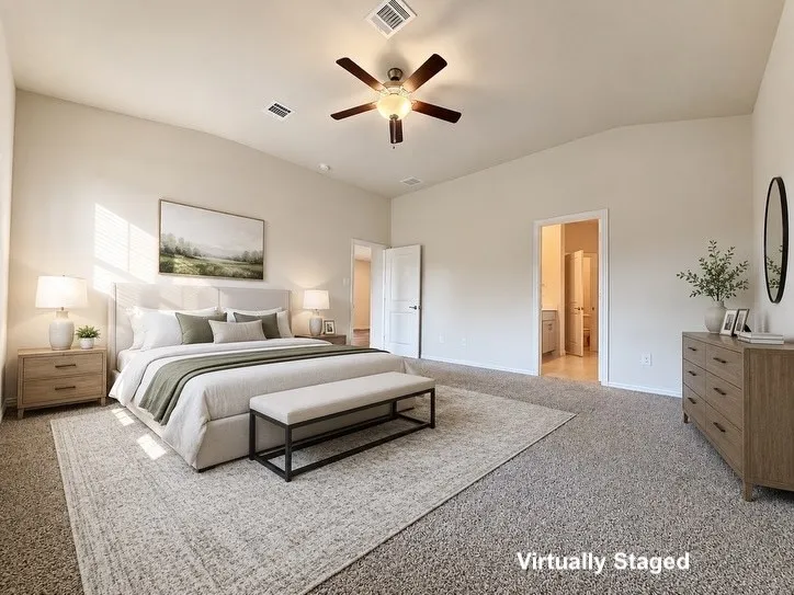 Carpeted room featuring light-toned walls, a vaulted ceiling with a ceiling fan, and recessed lighting
