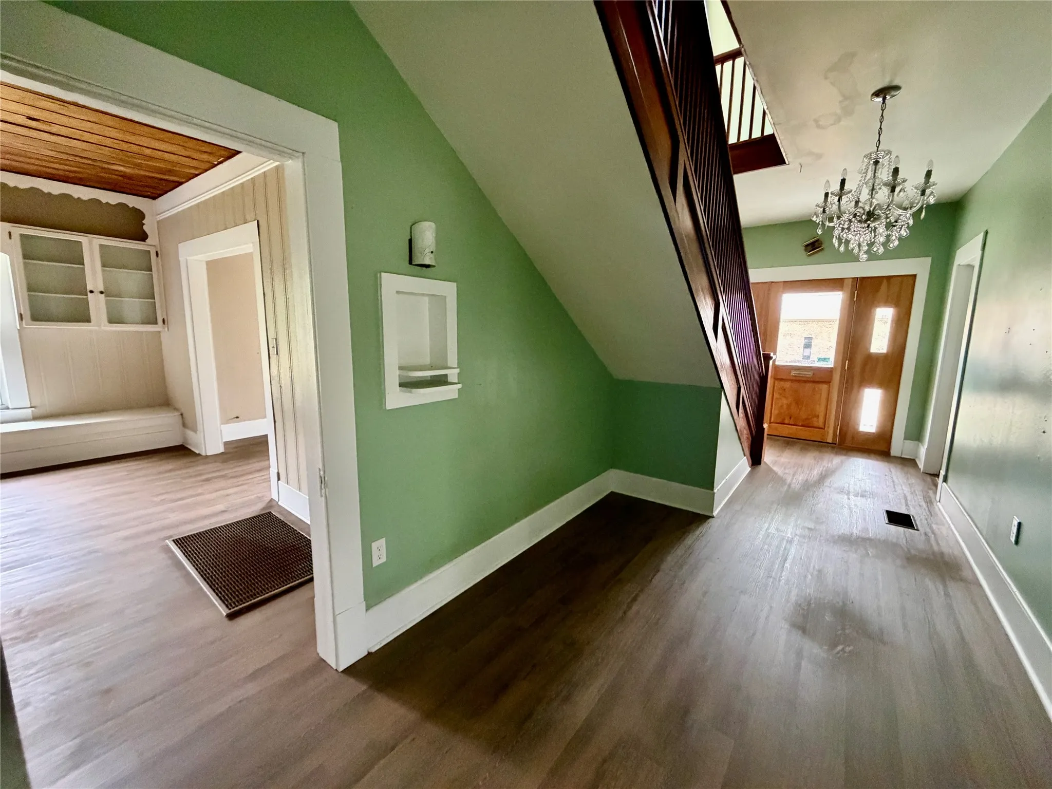 Looking toward the front door and into the dining room.