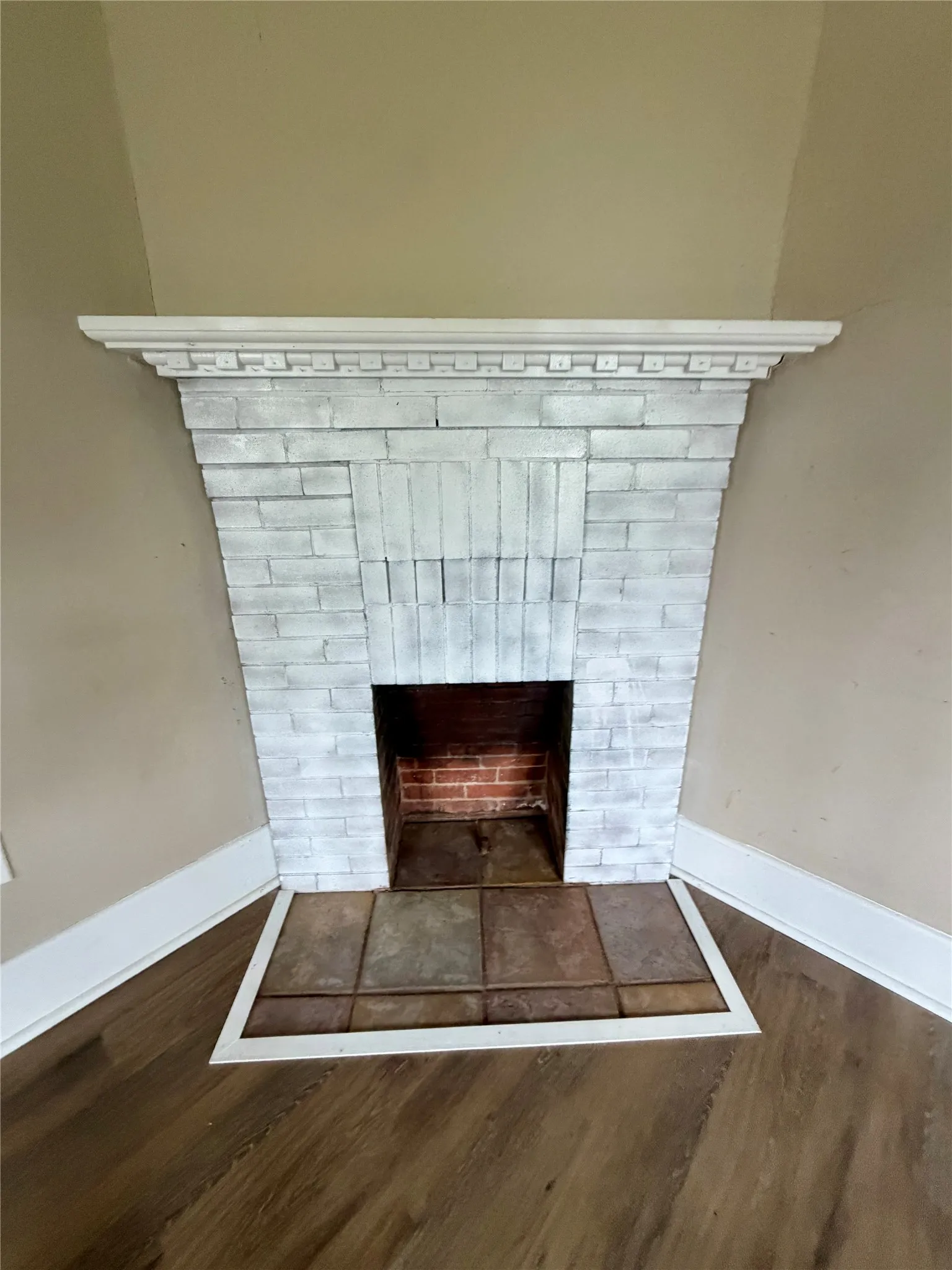 It is a mock fireplace now but was likely coal burning at one time.