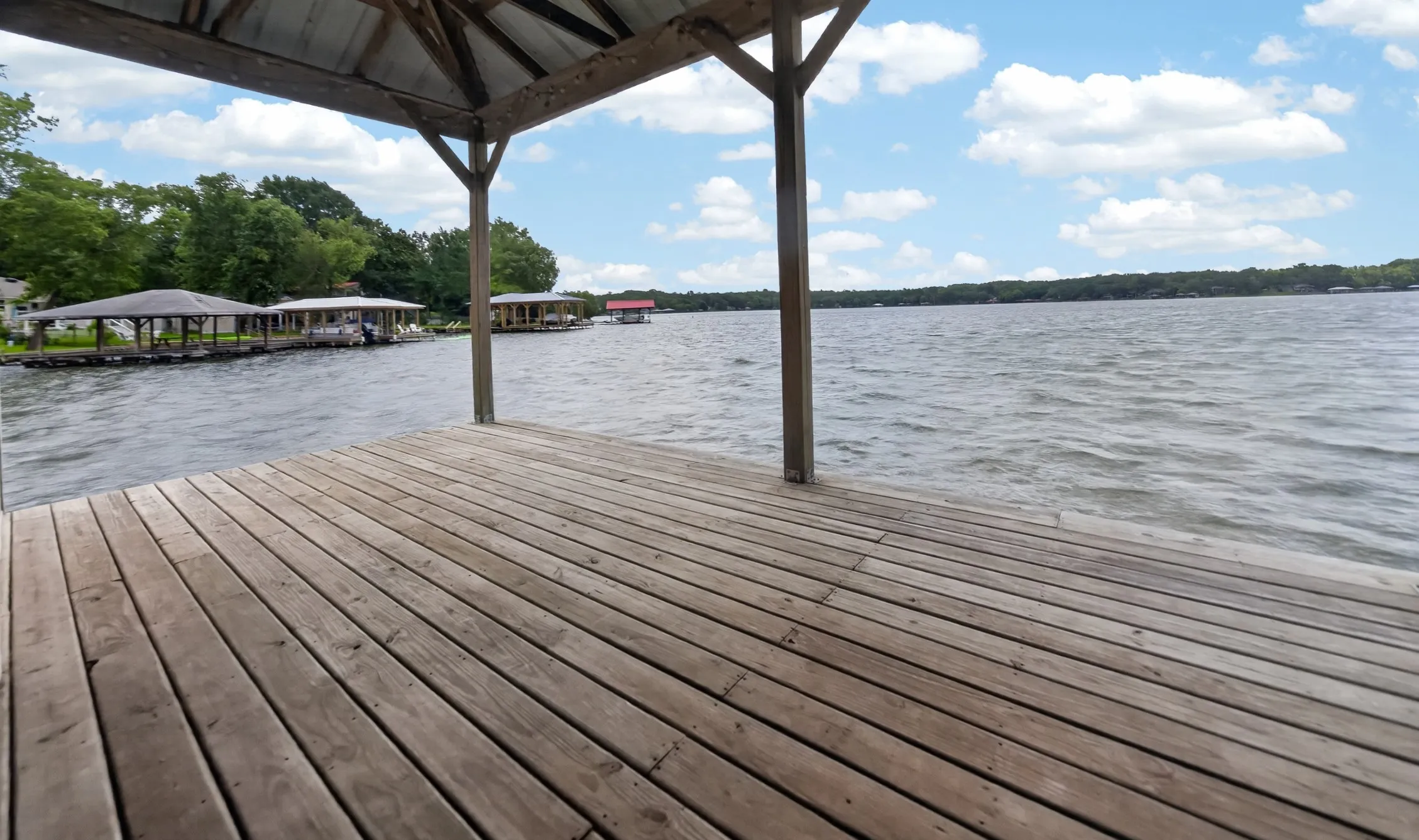 Large deck for relaxing or fishing. Boat house is 25X30 with metal roof.