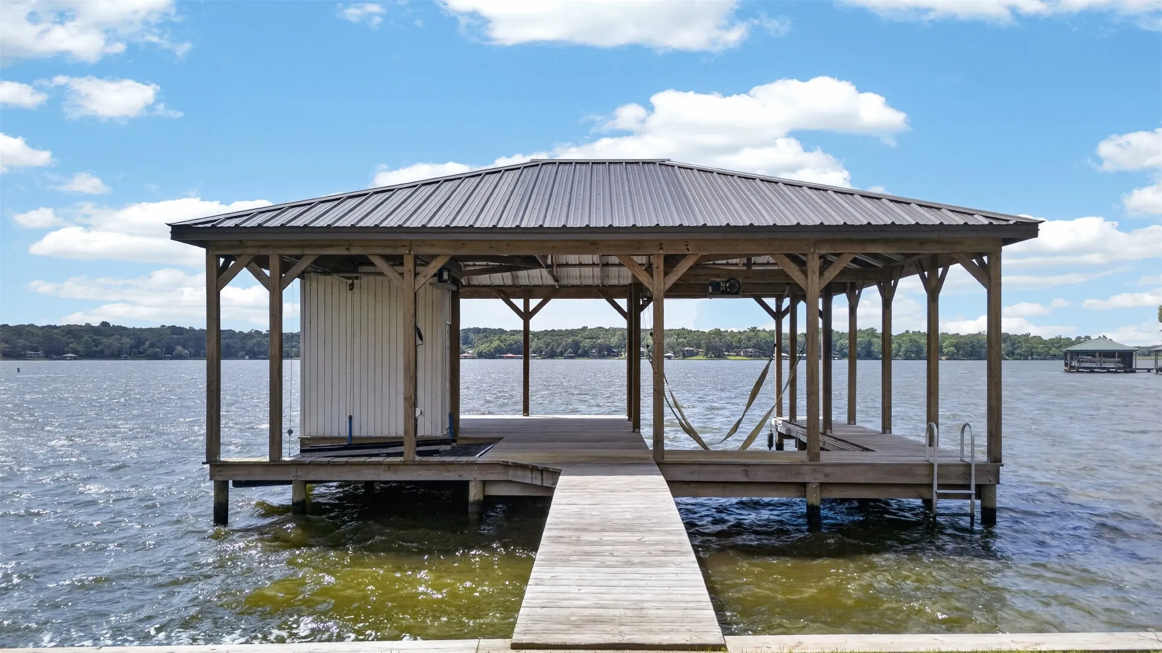 Water available at walkway to dock. Watercraft platform to the left is 10X11.5. Holds to Seadoo's