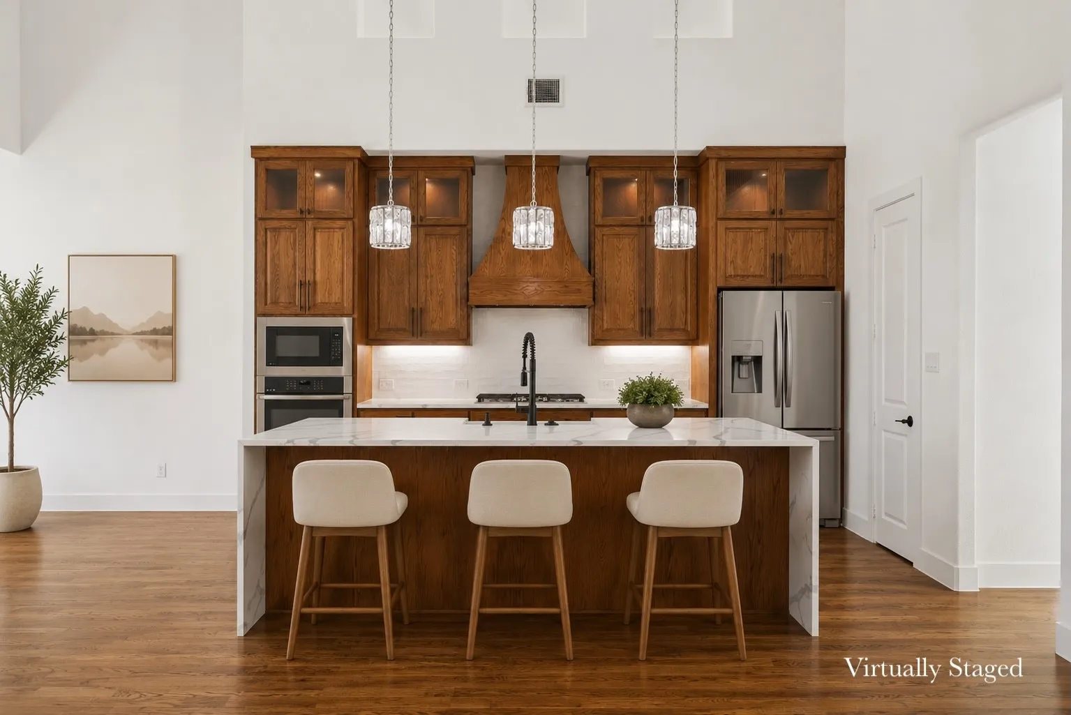 Open-concept kitchen featuring a waterfall island with a stone countertop, wood-finish flooring, stainless steel appliances, and cathedral ceilings