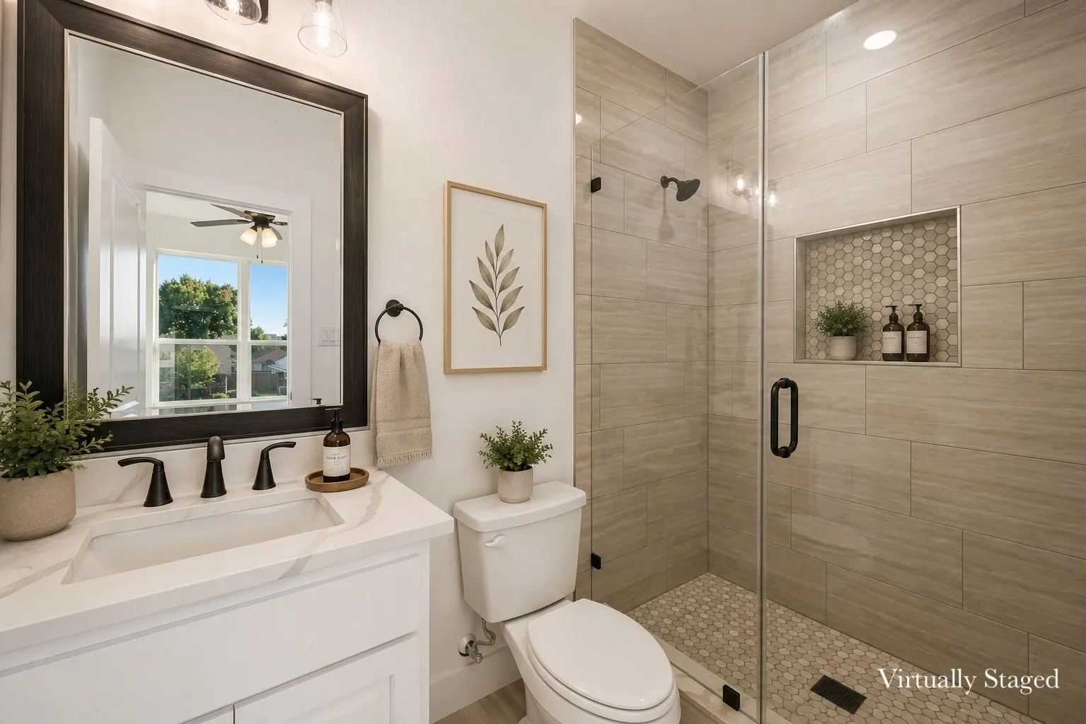 Contemporary bathroom featuring a frameless glass shower enclosure with a recessed niche, a single vanity with a white countertop and undermount sink, matte black fixtures, and light-toned tile work throughout