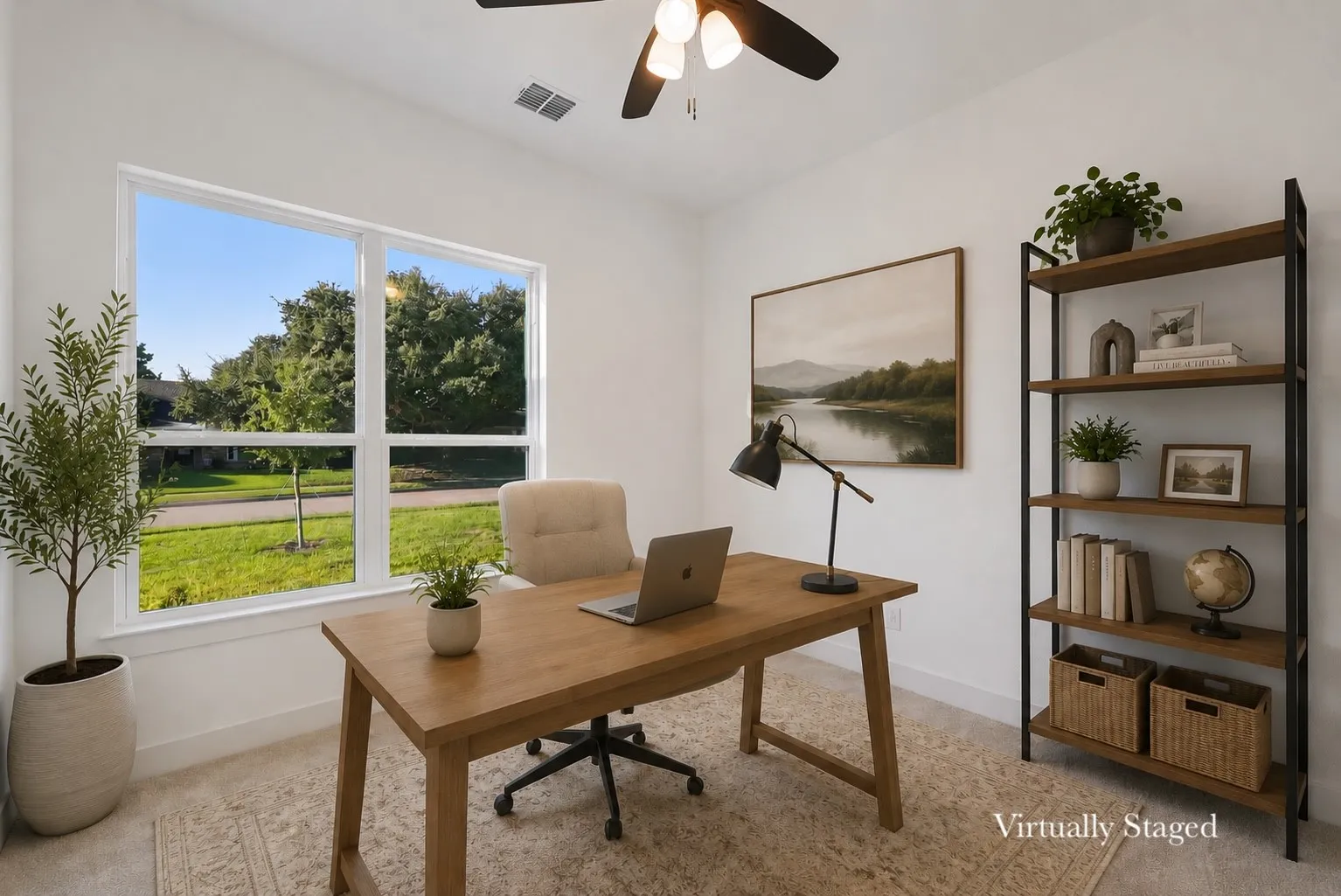 Bright room with a large double window and a ceiling fan