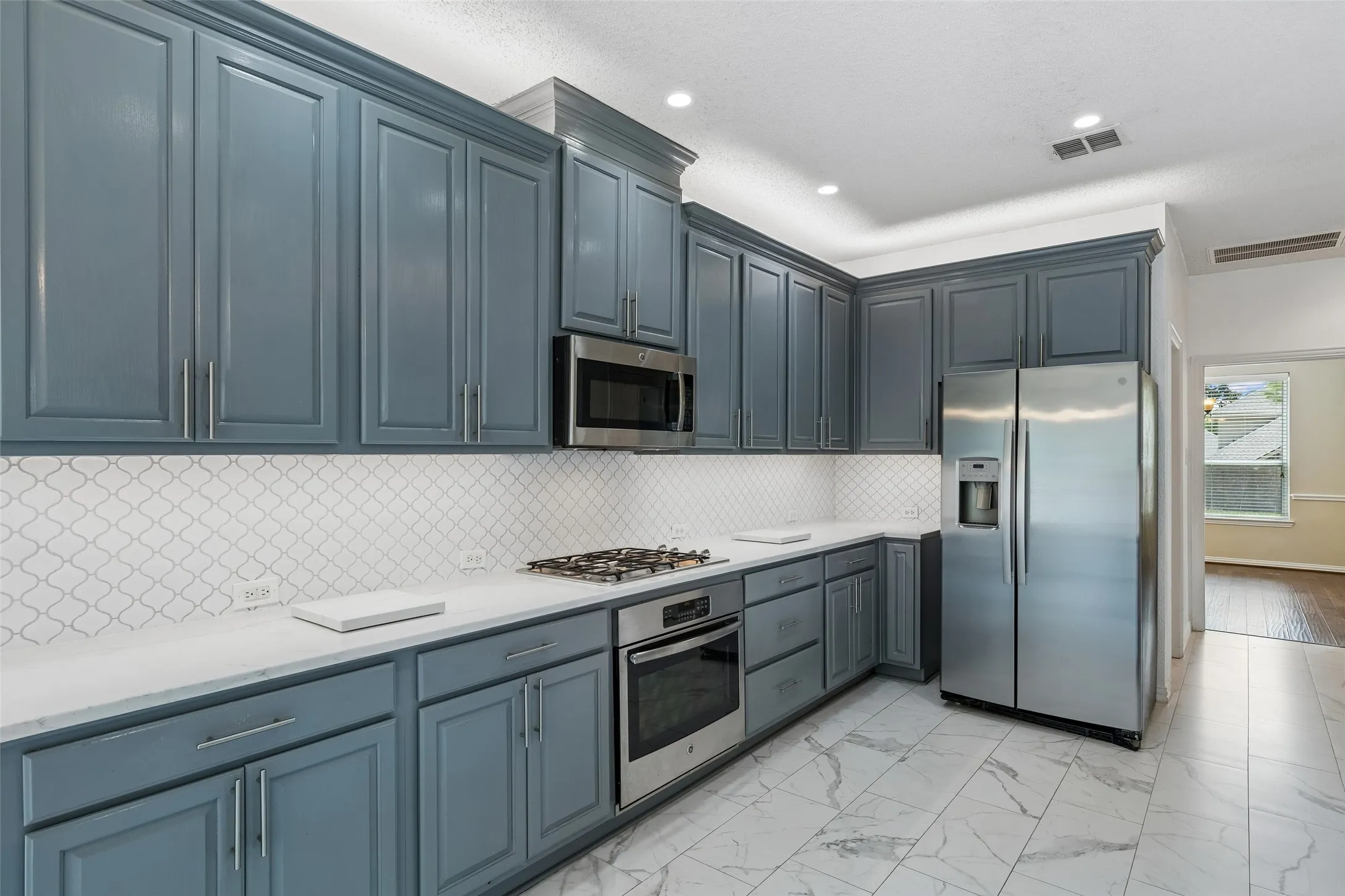 Stainless steel appliances and the refrigerator conveys with the home.