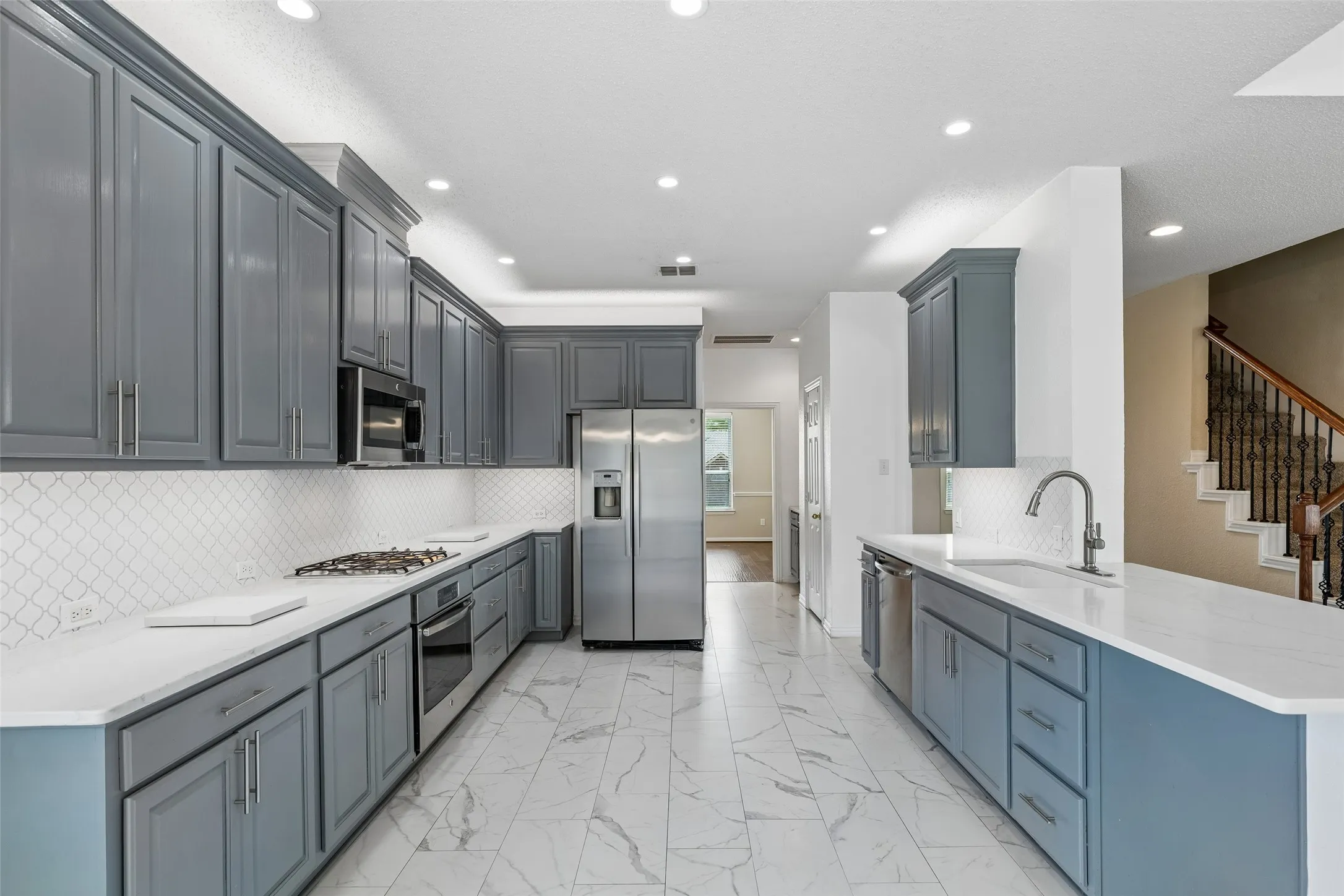 Kitchen storage that actually works for real life — plus uplighting and undermount cabinet lighting that make this space feel like home, day or night