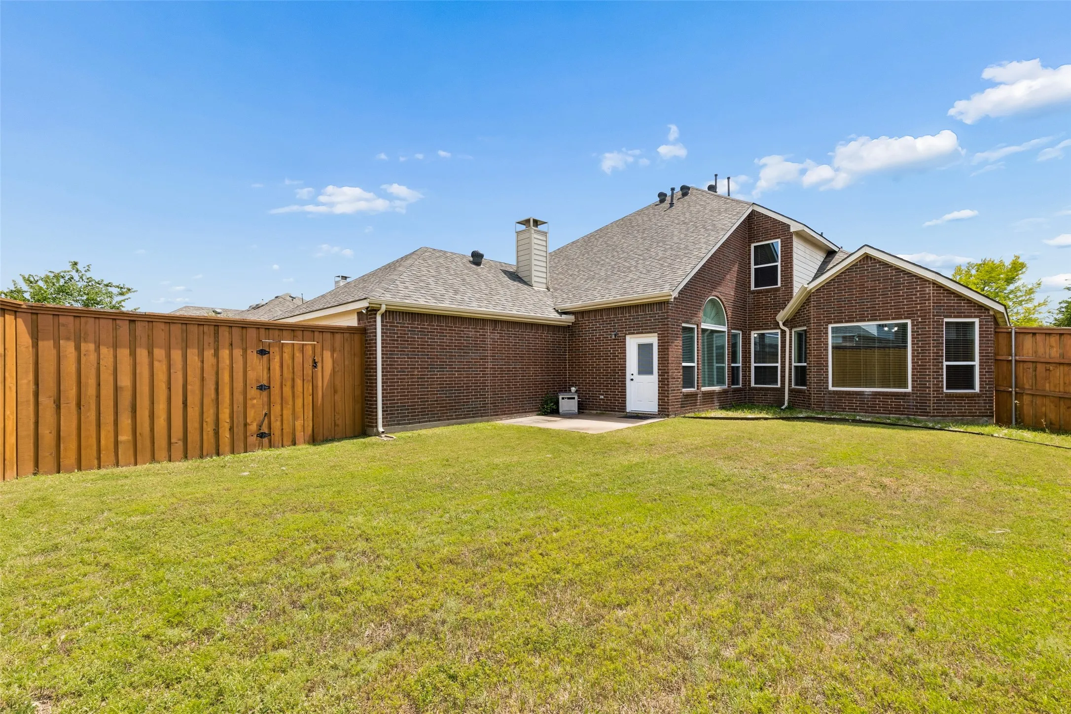 Large yard with plenty of space for kids and pets to play