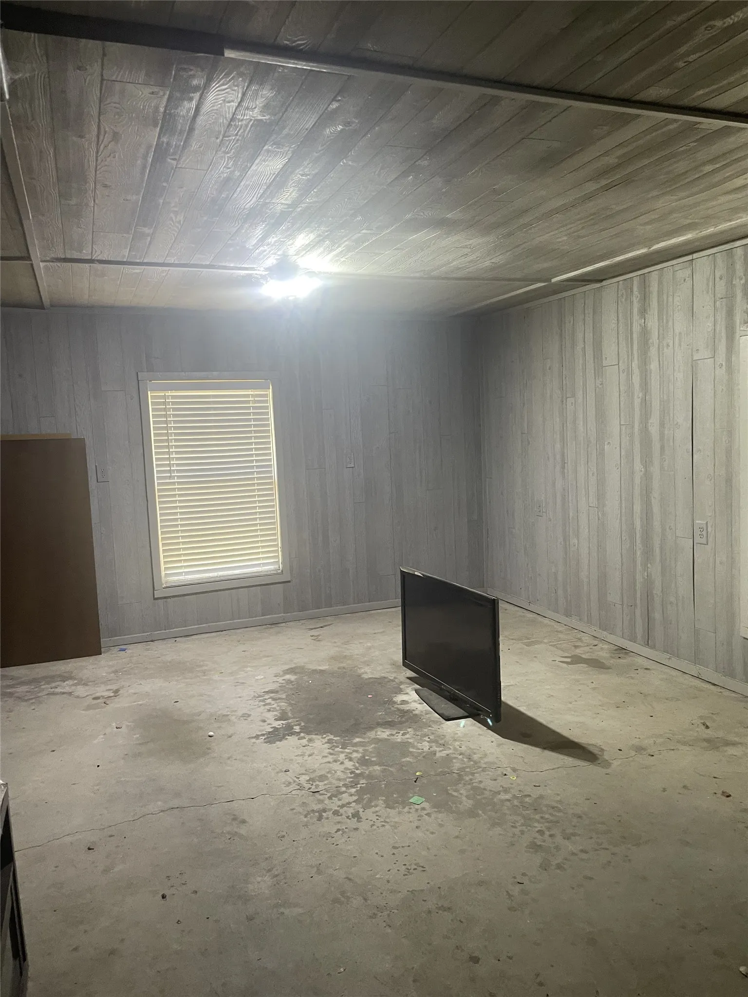 2 picture of inside garage . Finished paneling