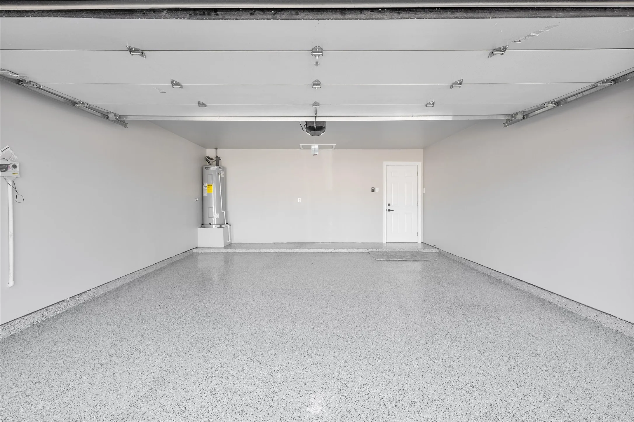 New epoxy floors, insulated garage door, new opener and new water heater