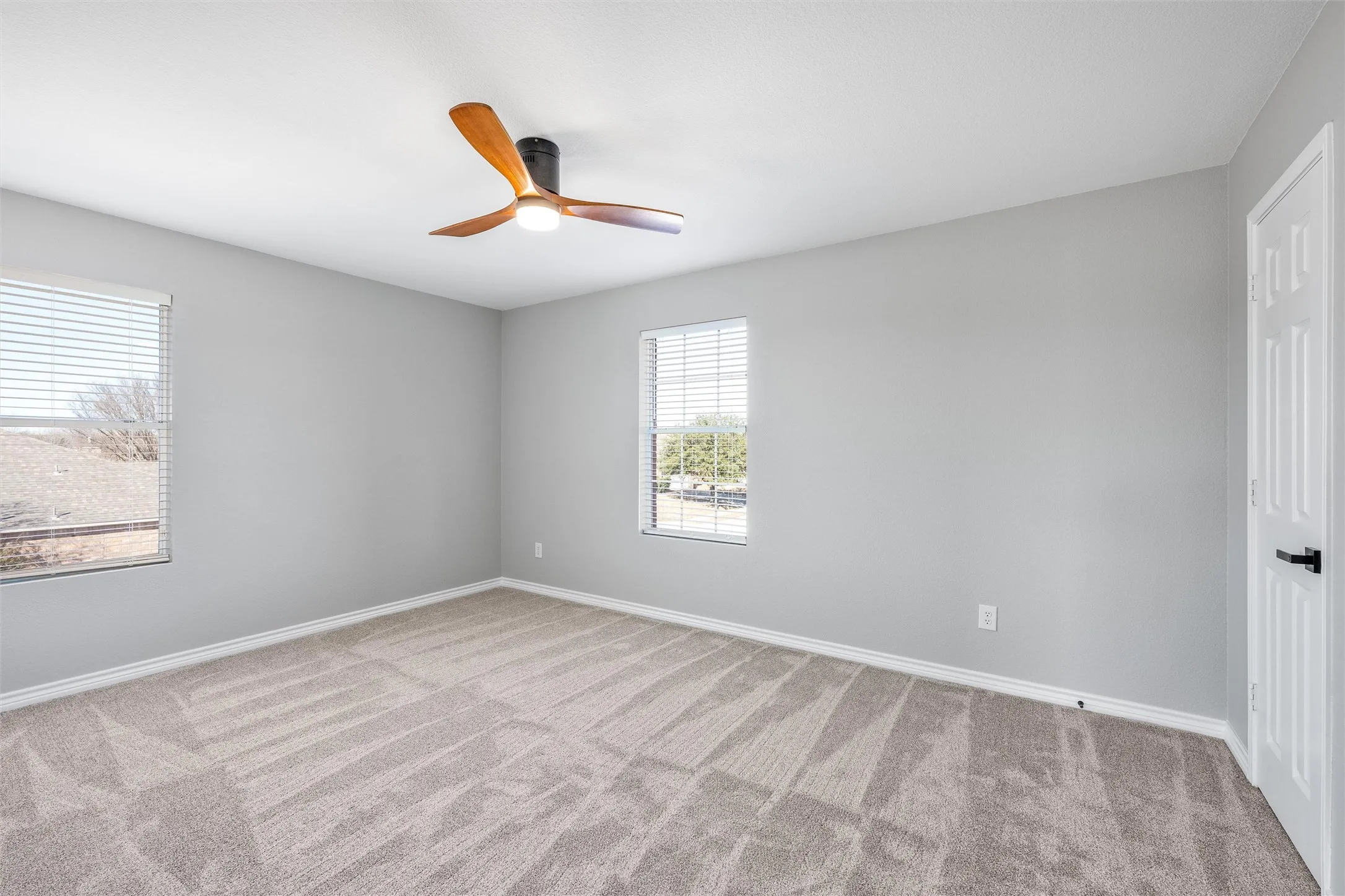 Upstairs Bedroom #2 with walk in closet, new carpet and ceiling fan