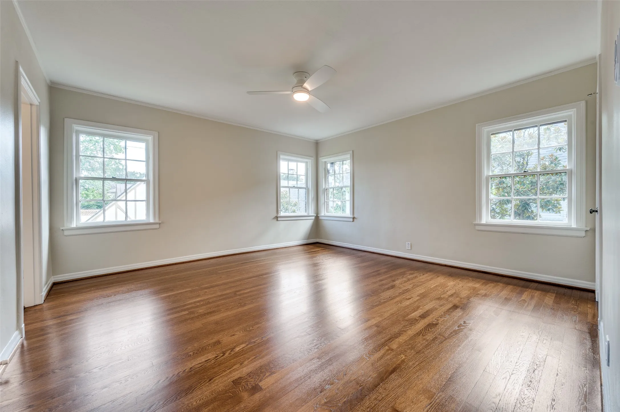  Large bedroom featuring much natural light.