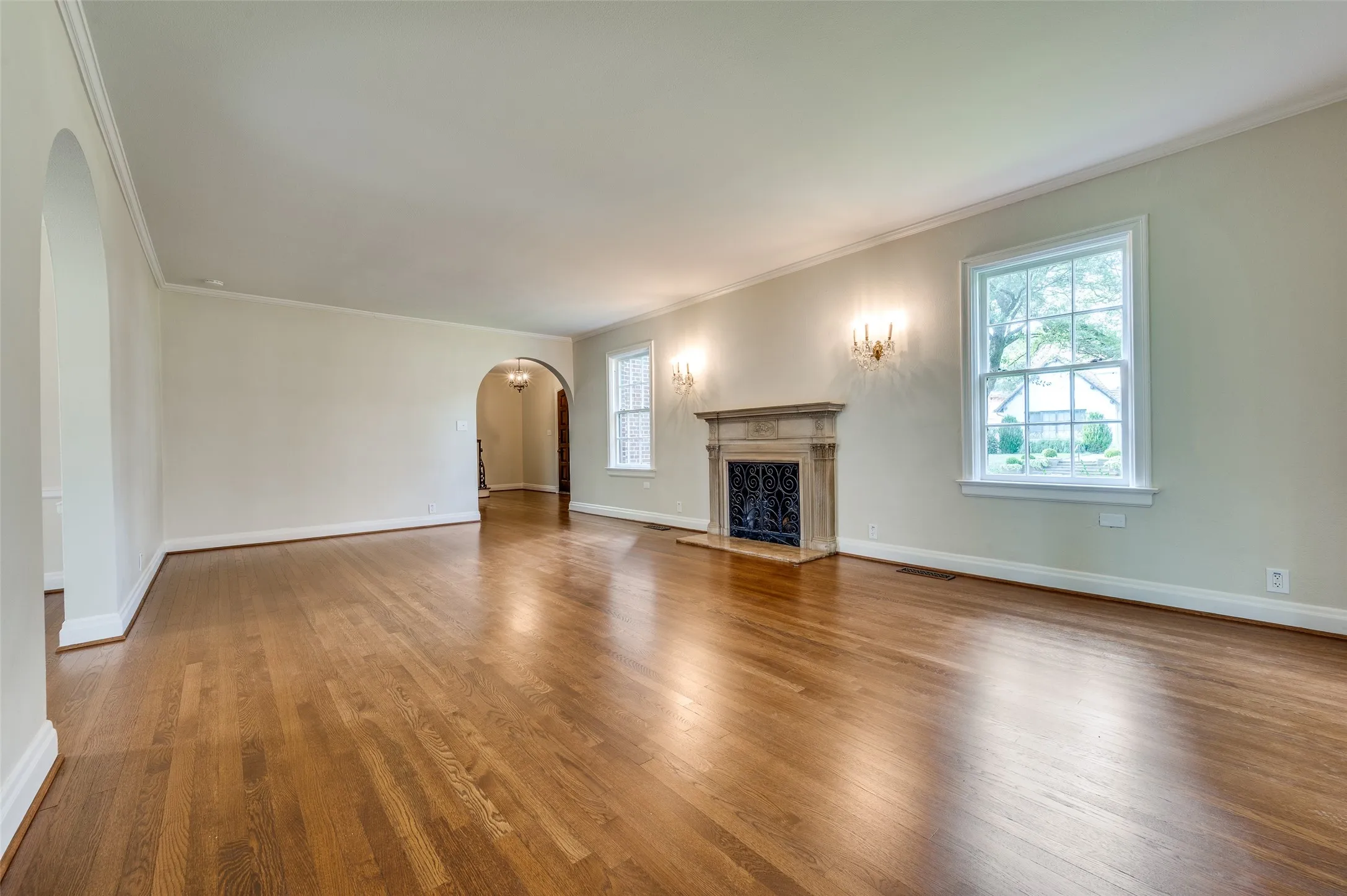 Spacious living room with elegant fireplace.