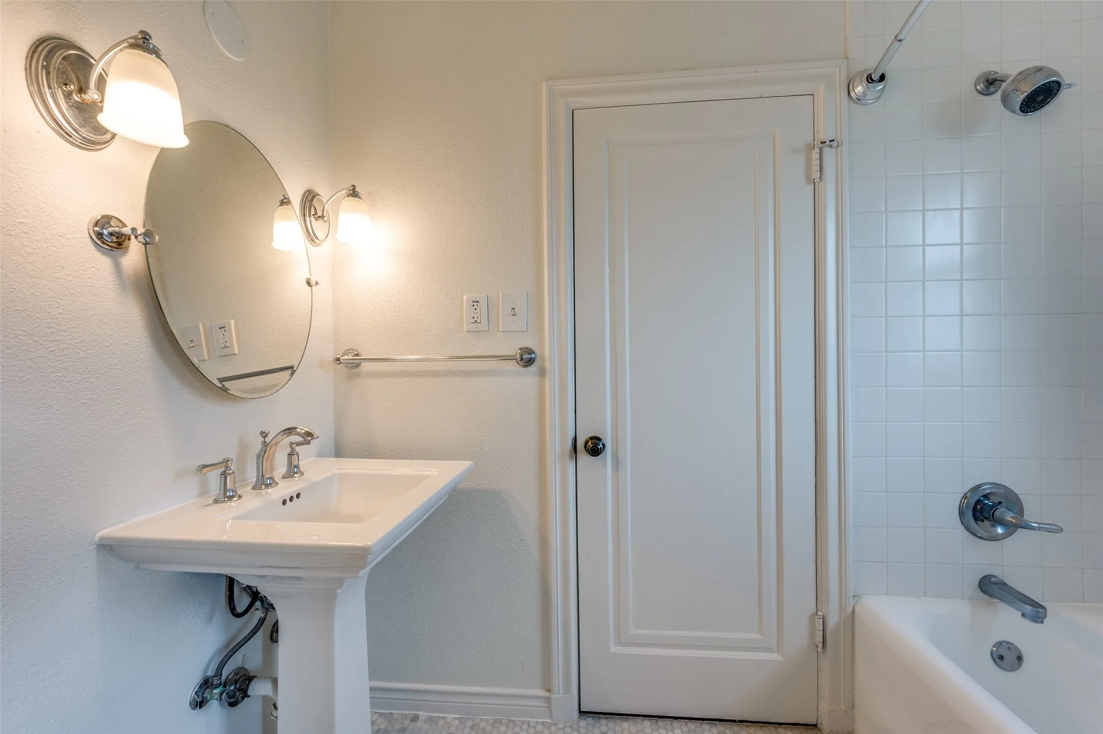 Refreshed full bathroom on second floor featuring shower / tub combination.