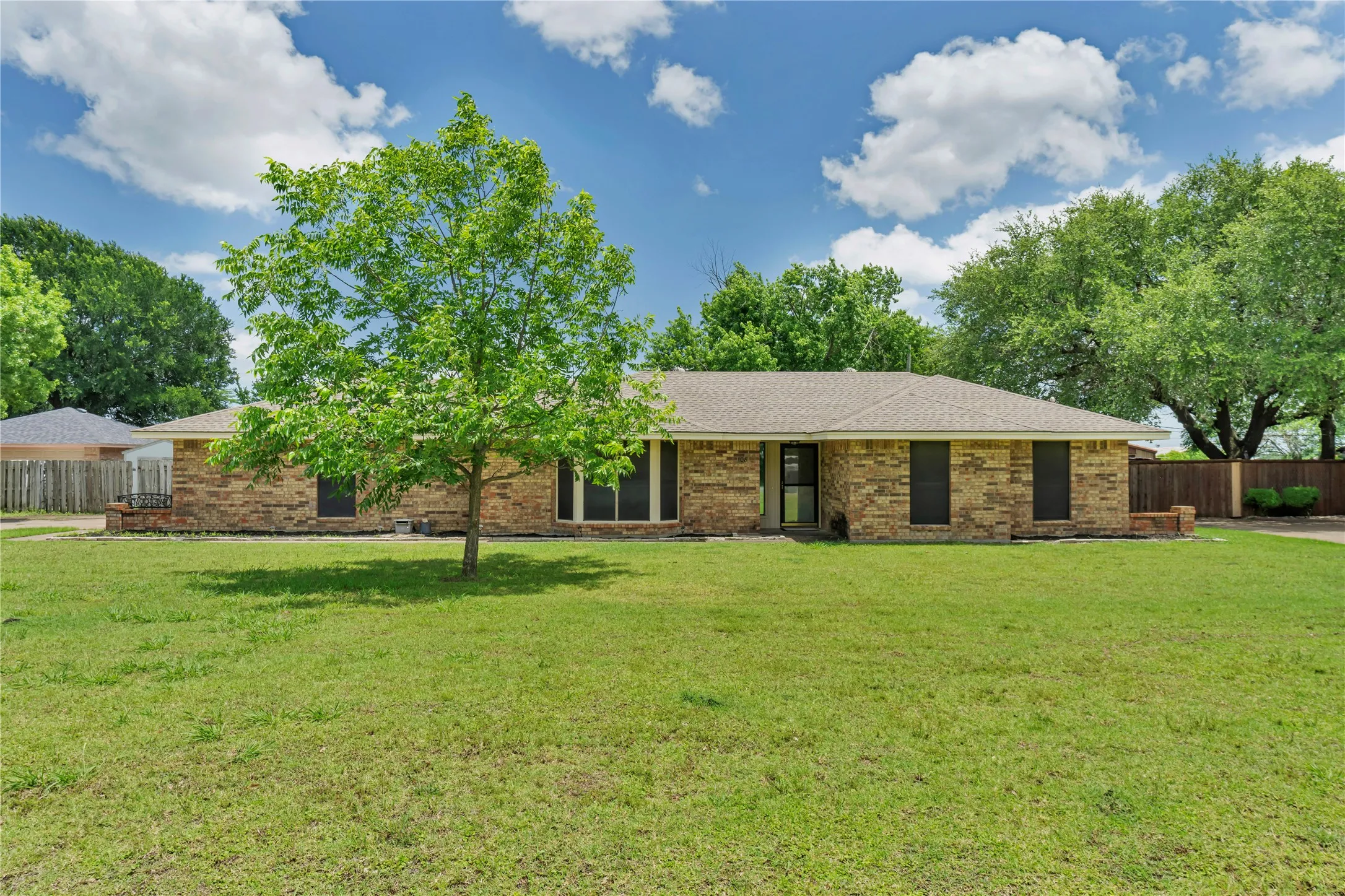 Brick exterior with a gabled roofline