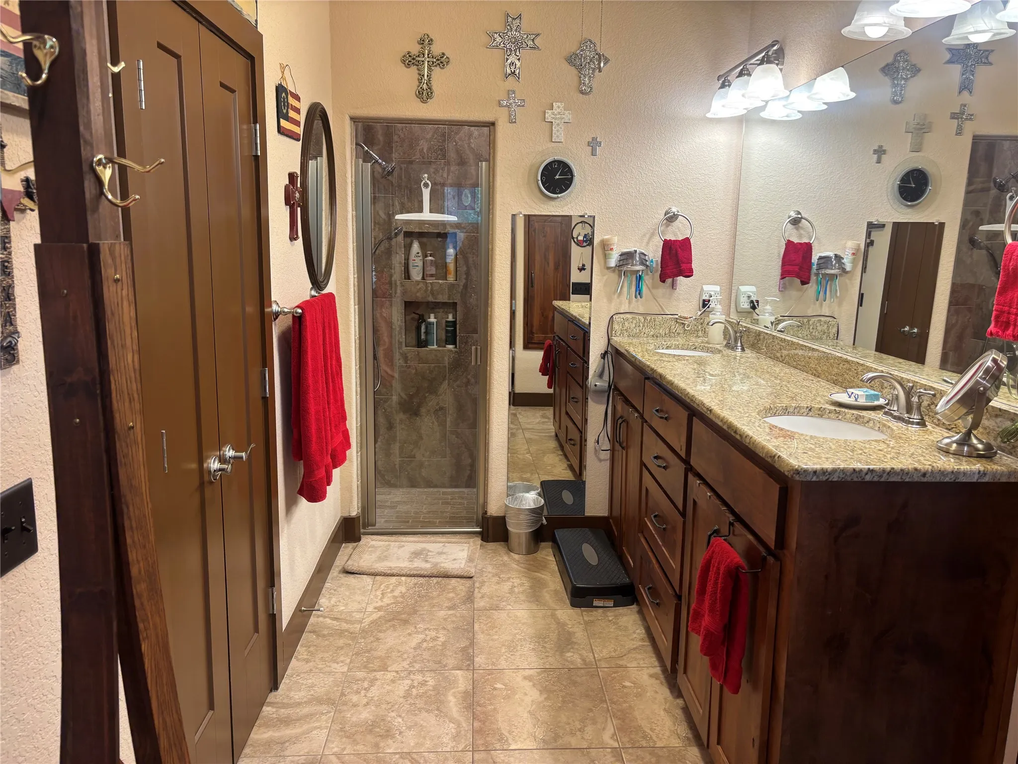 Double vanity in primary bathroom, ceiling fan and walk in shower