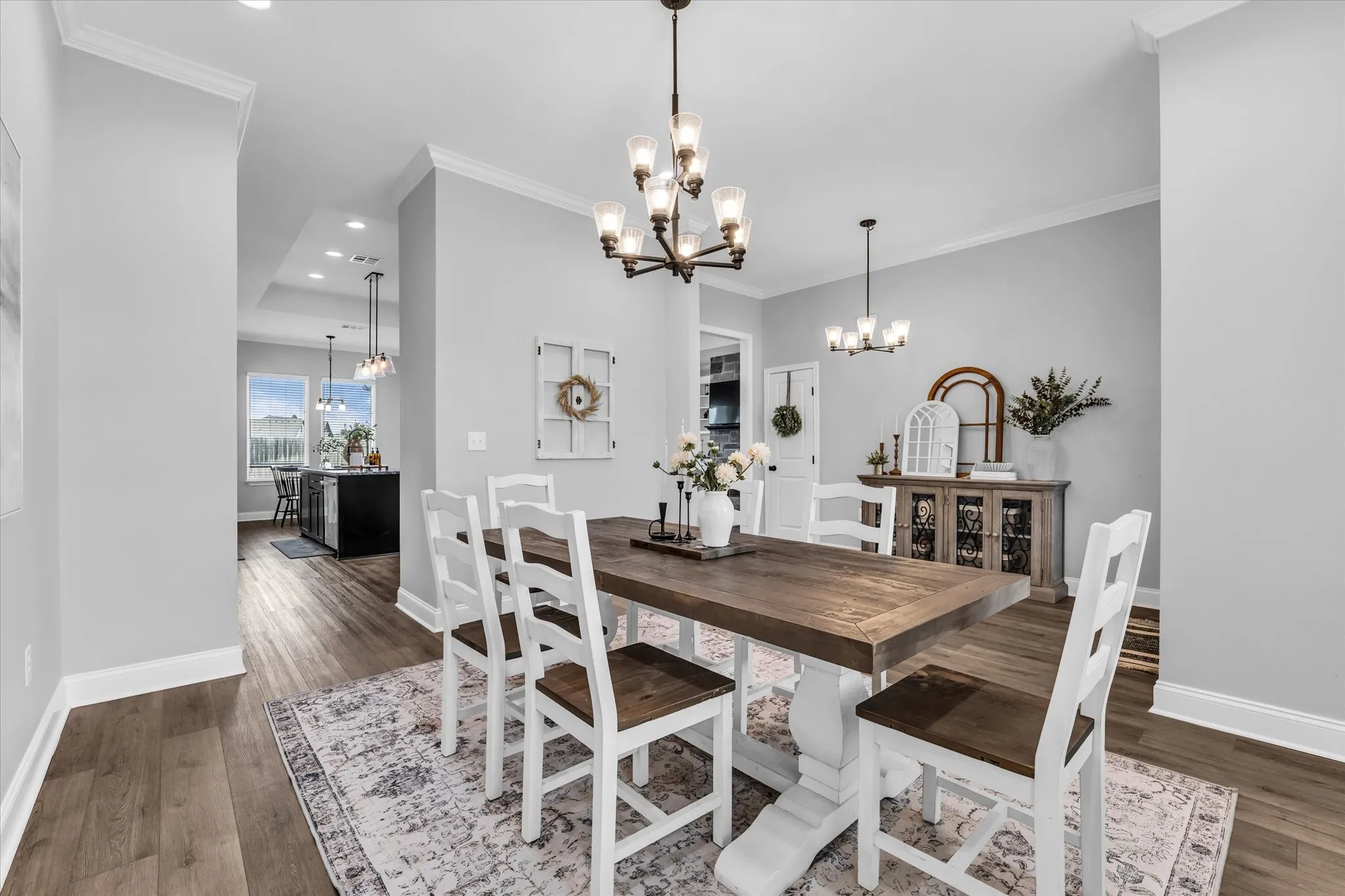 dining room flows easily to the kitchen and entryway for ease of hosting and entertaining