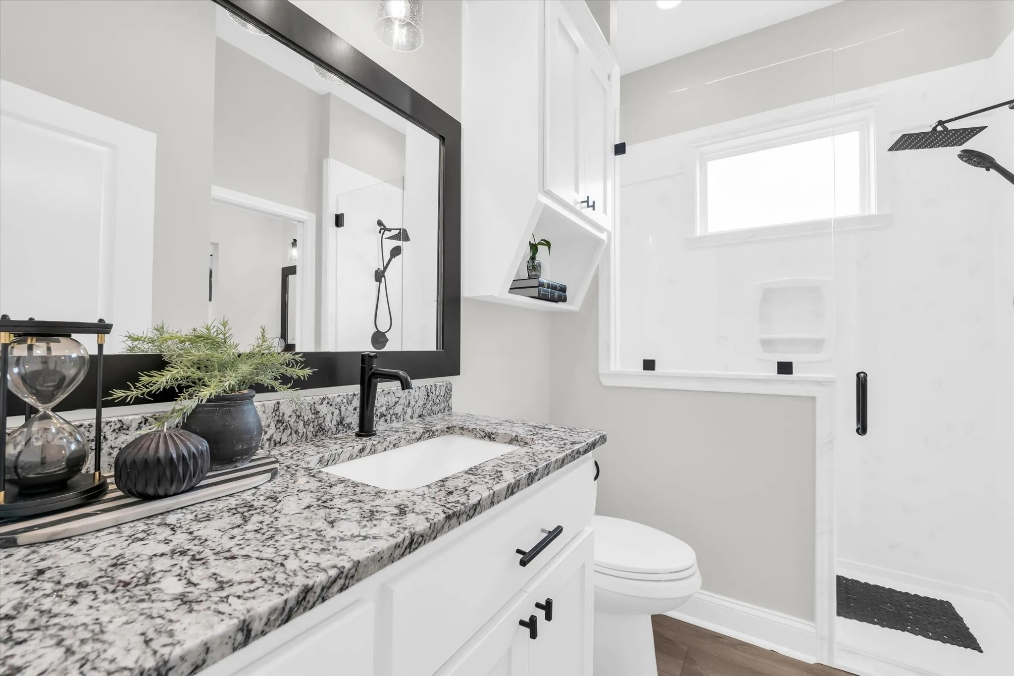 shared secondary bathroom with tiled shower