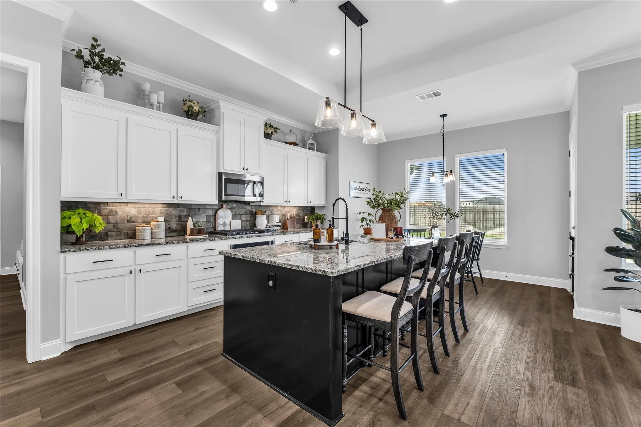 endless storage in the large chef's kitchen and plenty of workspace for helpers in the kitchen