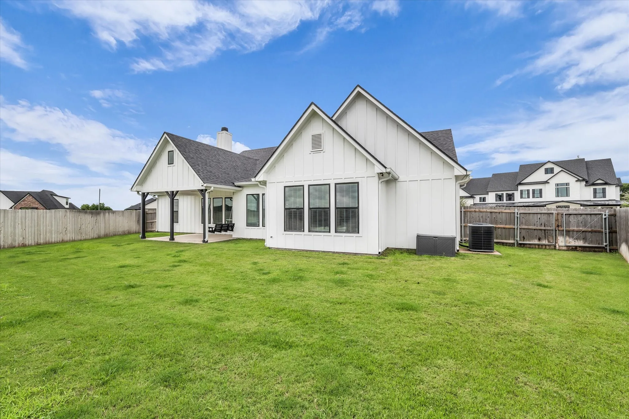 a backyard oasis is ready for your dreams to come true and still room to play; large gate for lawn tractor entry